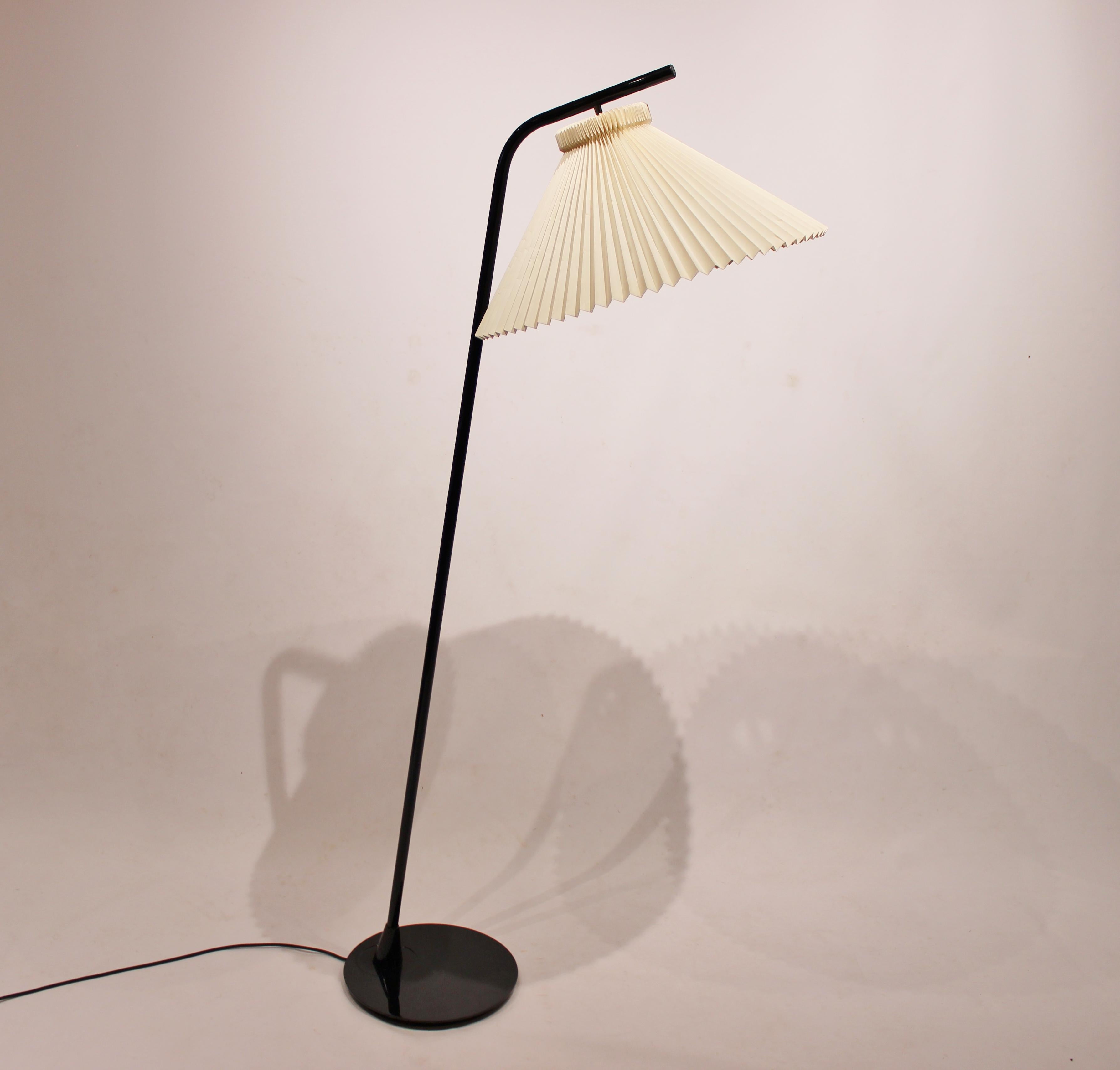 Floor lamp of Danish design from the 1980s with shade by Le Klint. The lamp is in great vintage condition and with light dimming function.