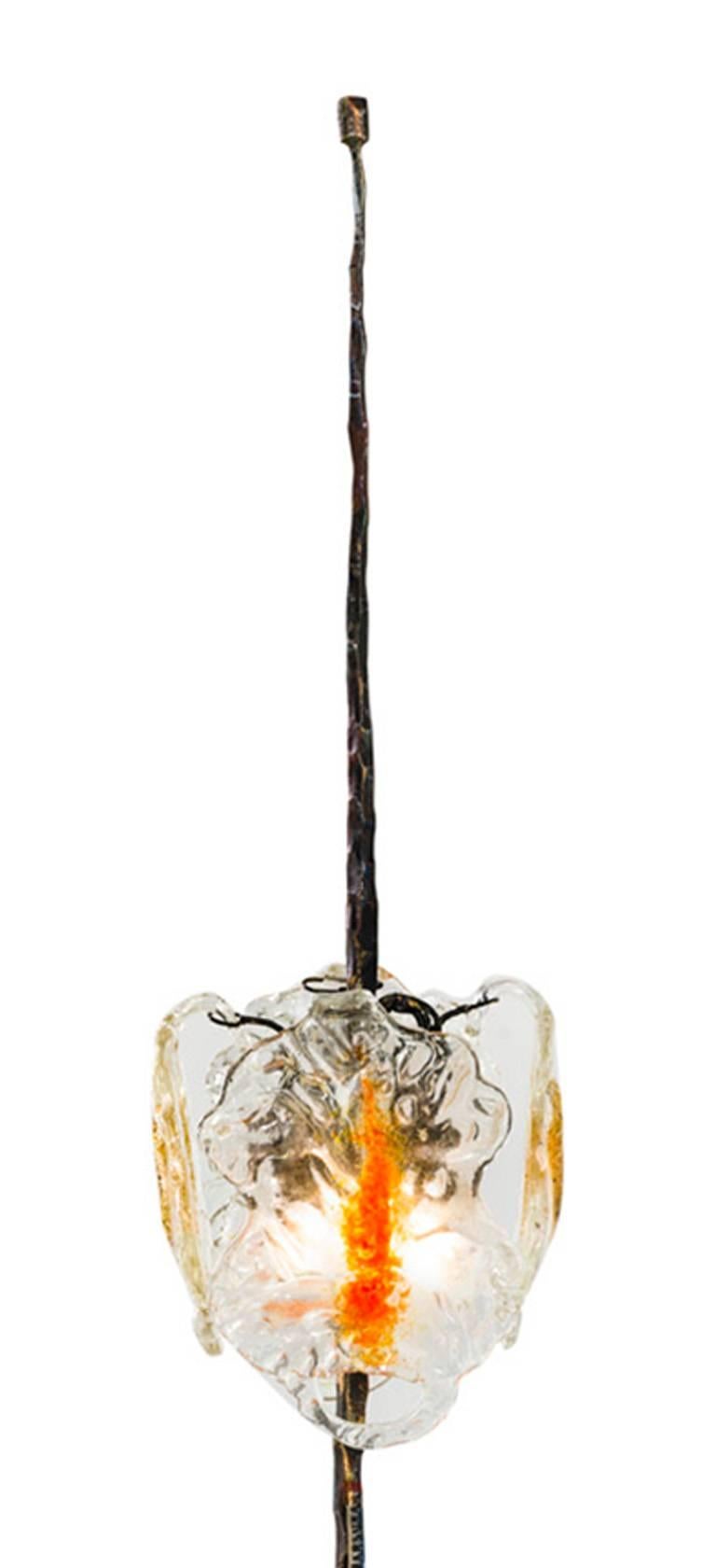 Floor lamp by Salvino Marsura
Hand-forged wrought iron with four hanging Murano glass petals which form the shade.
Made in Treviso, Italy.