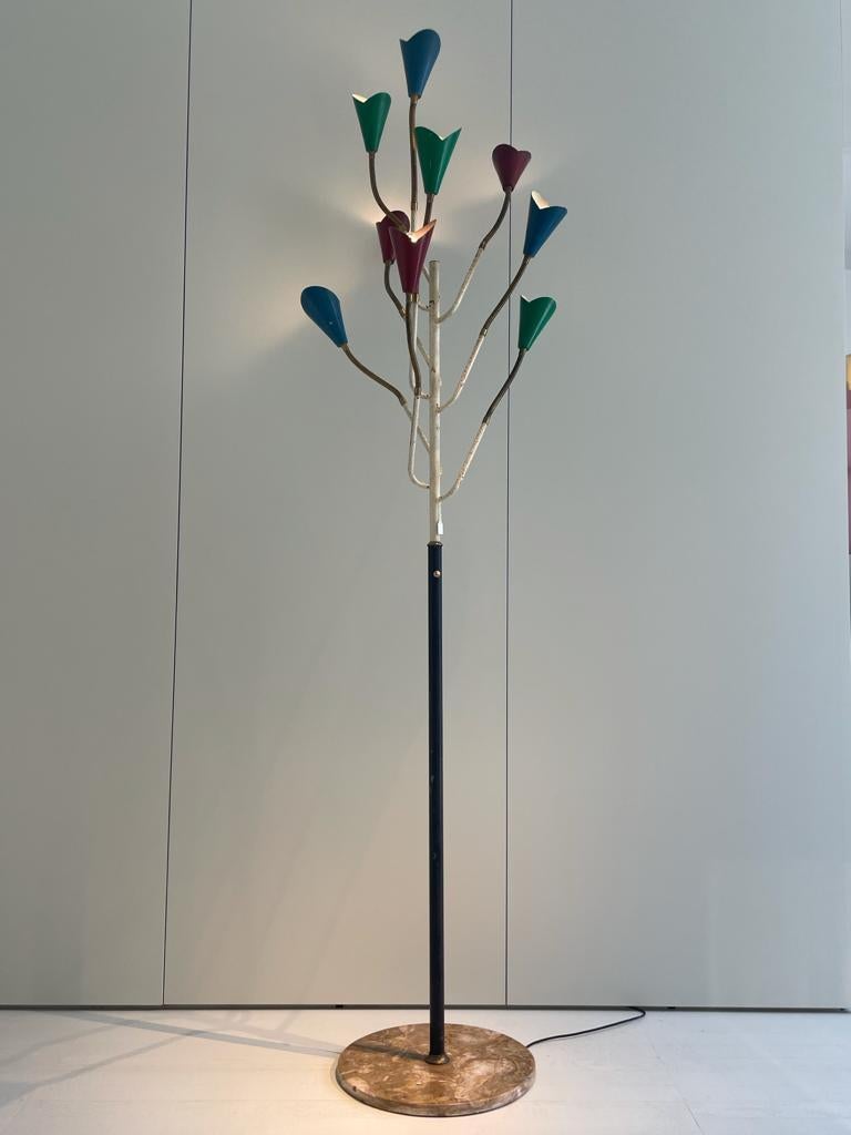 Floor lamp manufactured by Stilnovo in Italy, 1950s.
Floor lamp that takes the shape of a tree, with its black lacquered metal stem that is interrupted by a brass ring and that continues in the upper part with a white lacquered metal stem, from