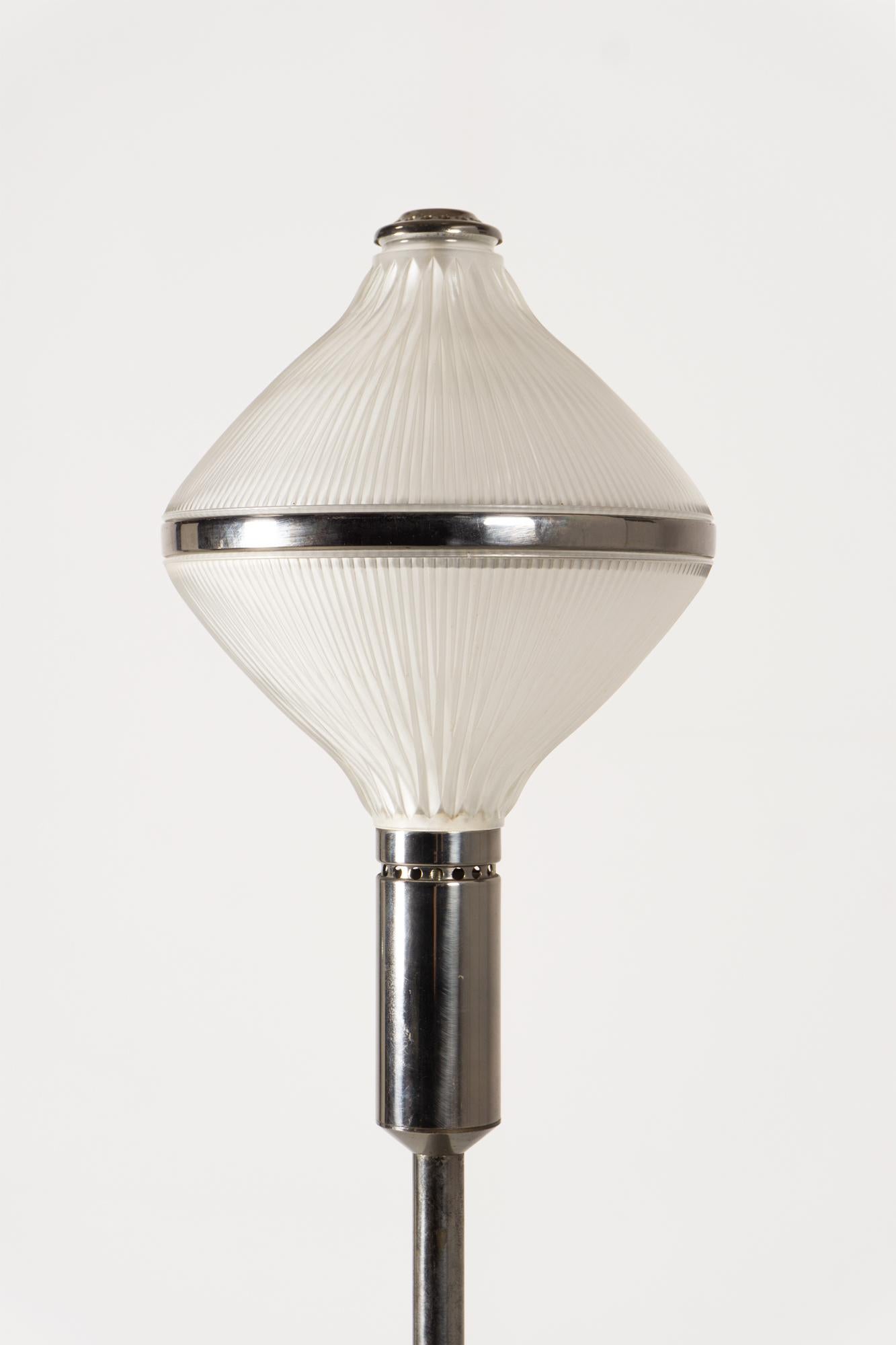 This beautiful floor lamp was designed by Studio BBPR for Artemide in 1964. Made from metal and pressed glass.