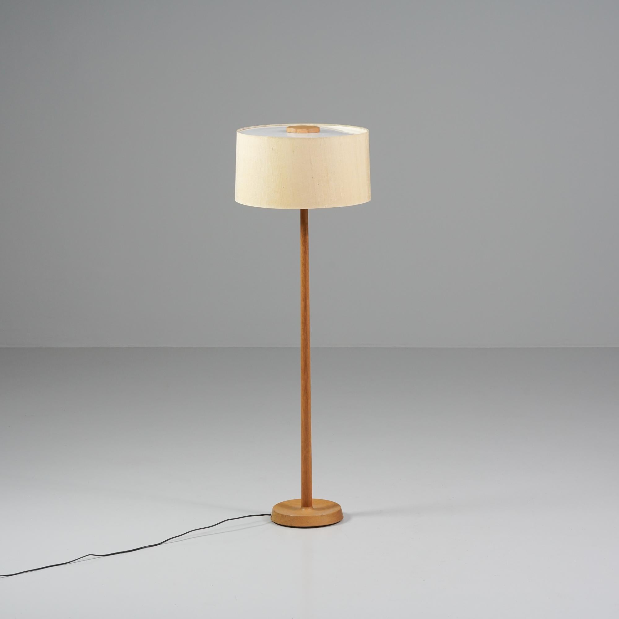 Floor lamp, manufactured in Sweden, 1960s. Oak frame. Acrylic and fabric shade. Good vintage condition, minor patina consistent with age and use. 