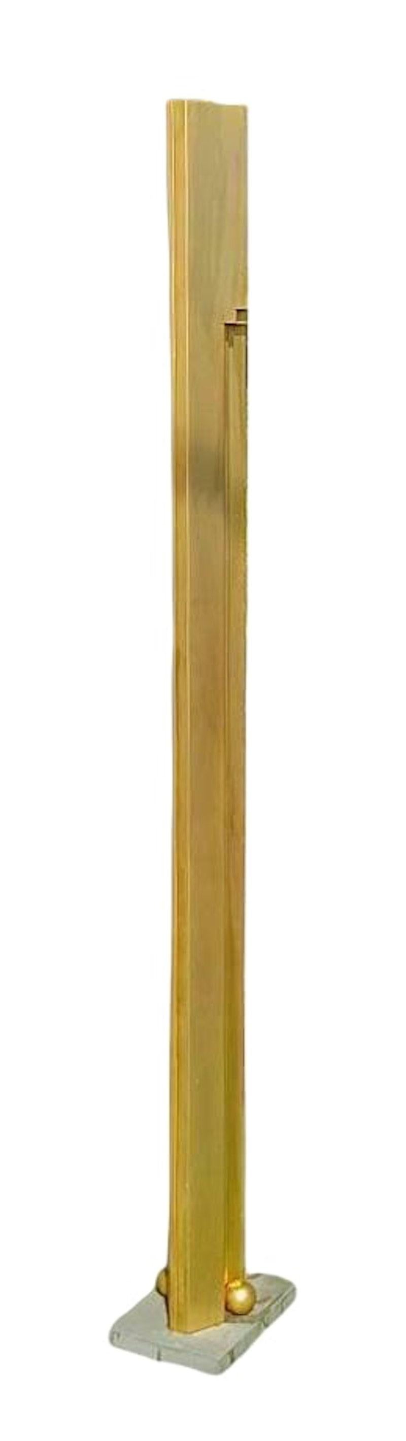 Floor lamp produced by Sirrah from the 80s, rare designed by Kazuhide takahama, made of gold-colored aluminum, a real luminous sculpture with base in gray-colored pietra serena -

measure cm. 180 in height, cm. 26 in width and cm. 18 deep,

in