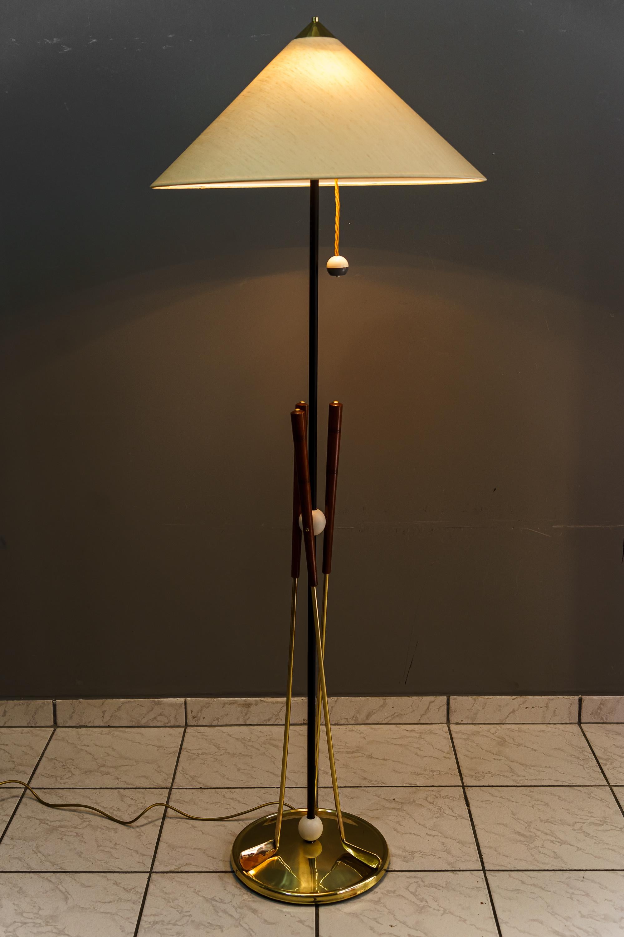 Floor lamp with 3 golf rackets italian around 1950s
Brass polished and stove enameled
Wood polished 
The fabric shade is replaced ( new )