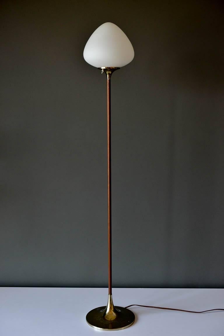 Floor lamp with acorn shade and walnut stem by Laurel Lamp Company, circa 1965. Brass base with original glass acorn shaped shade. Base has nice patina, as shown.

Measures: 58