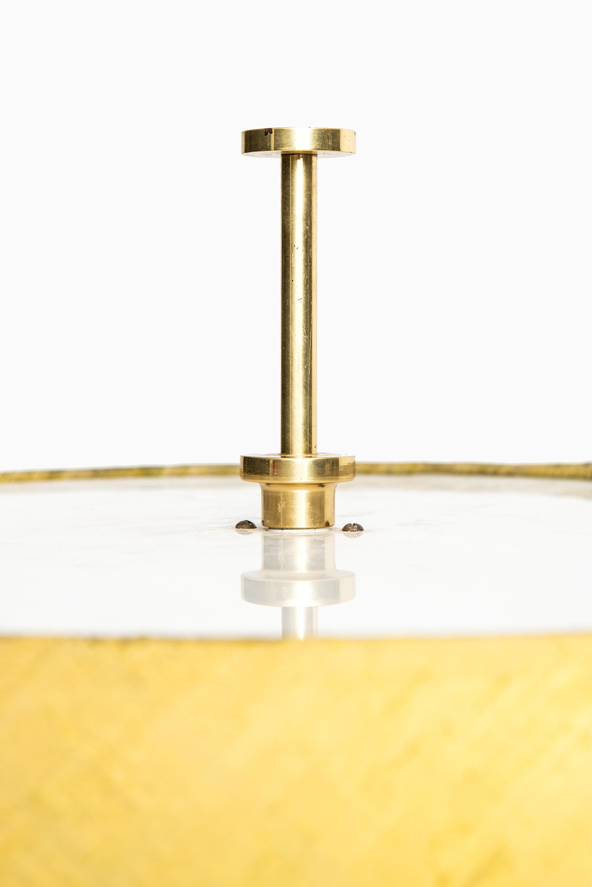 Floor lamp with adjustable height on shade. Probably produced by Bergbom in Sweden.