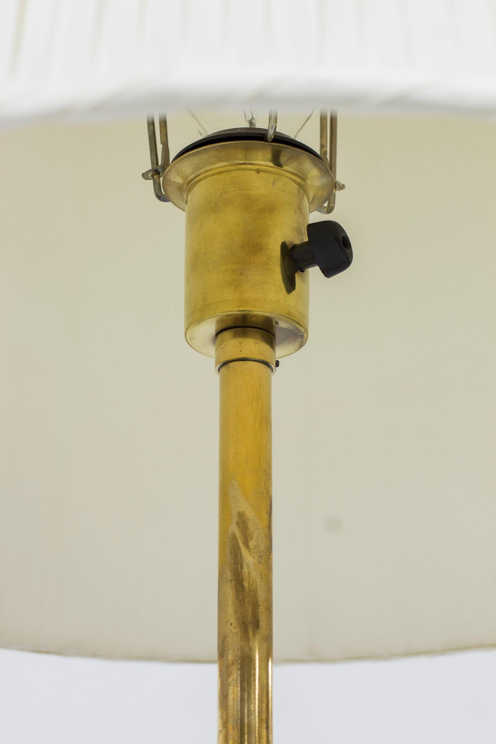 Swedish Floor lamp with leather and brass by Harald Notini, Böhlmarks, Sweden, 1950s For Sale