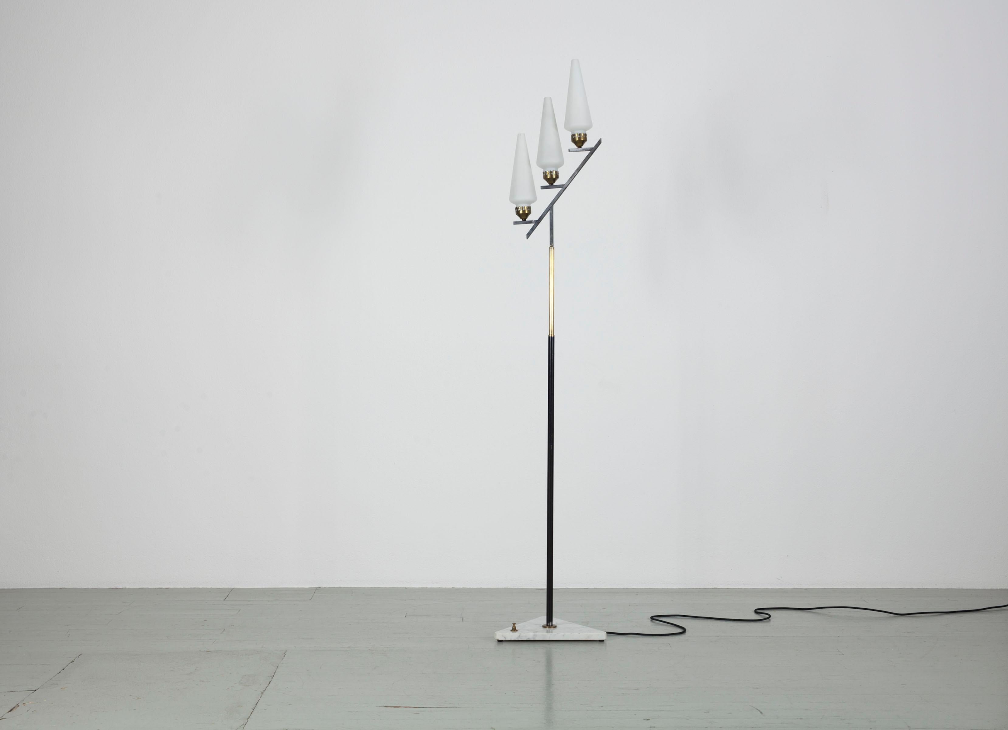 Floor lamp - Italy, 1950s. The lamp has three opal glass tubes, a lacquered metal rod with brass elements and a triangular marble base.
It has been completely rewired.