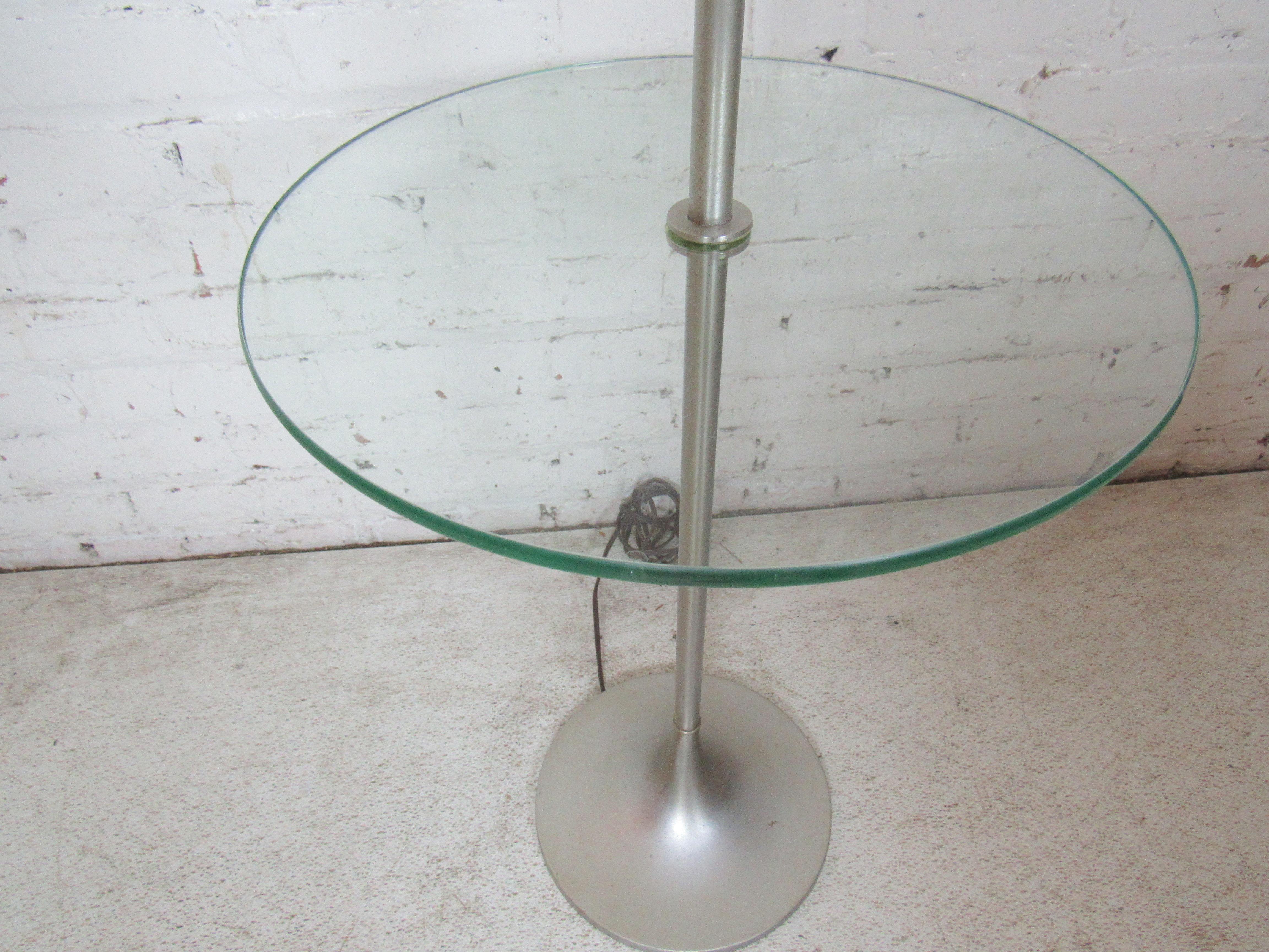 Modern style lamp with metal base and round glass shelf.
(Please confirm item location - NY or NJ - with dealer).
 