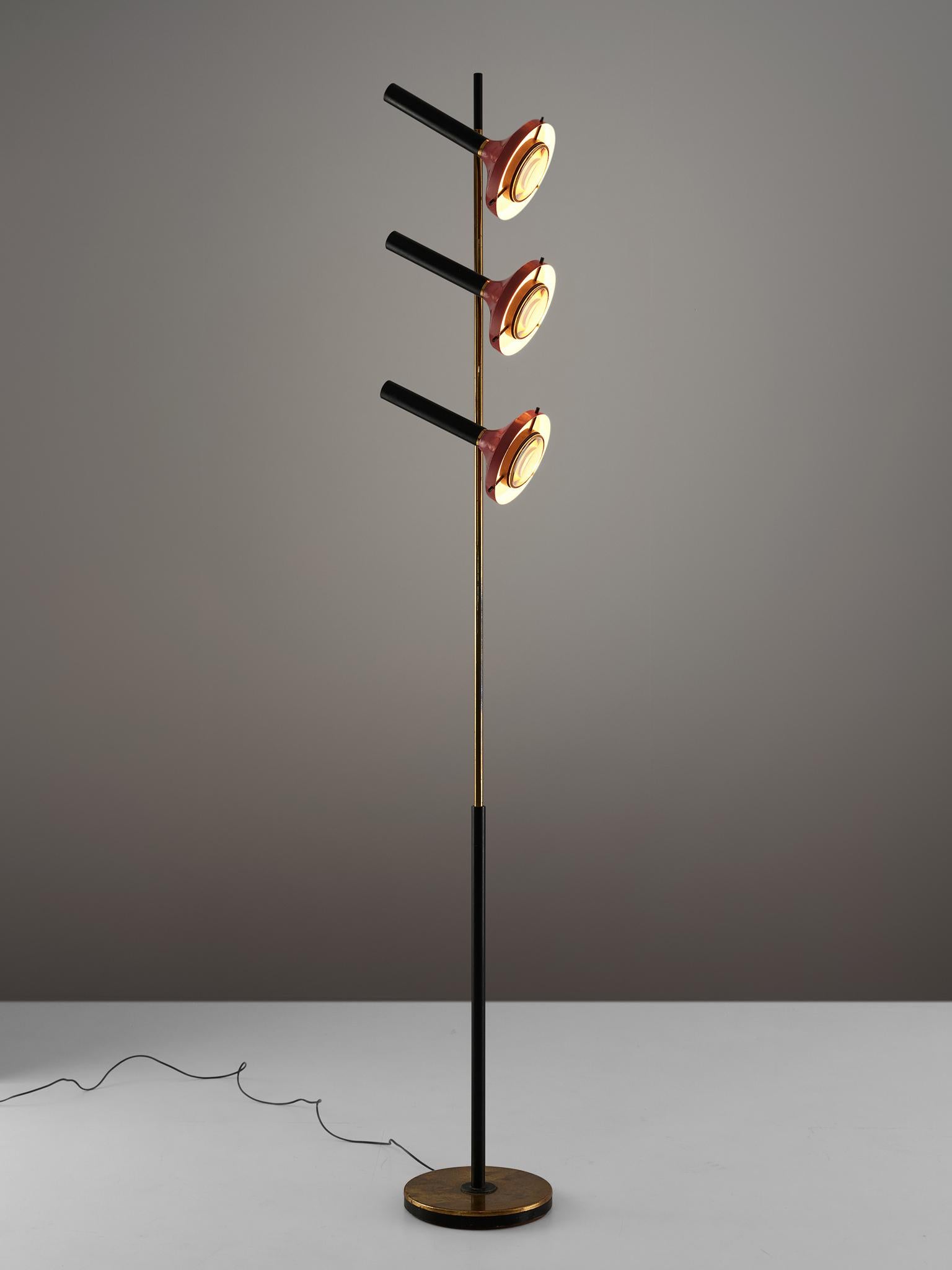Oscar Torlasco, floor lamp, metal and brass, Italy, 1950s.

Refined floor light with three shades by Italian designer Oscar Torlasco. The lamp consist of a round base in beautiful patinated brass. The stern is from brass with a black base. The three