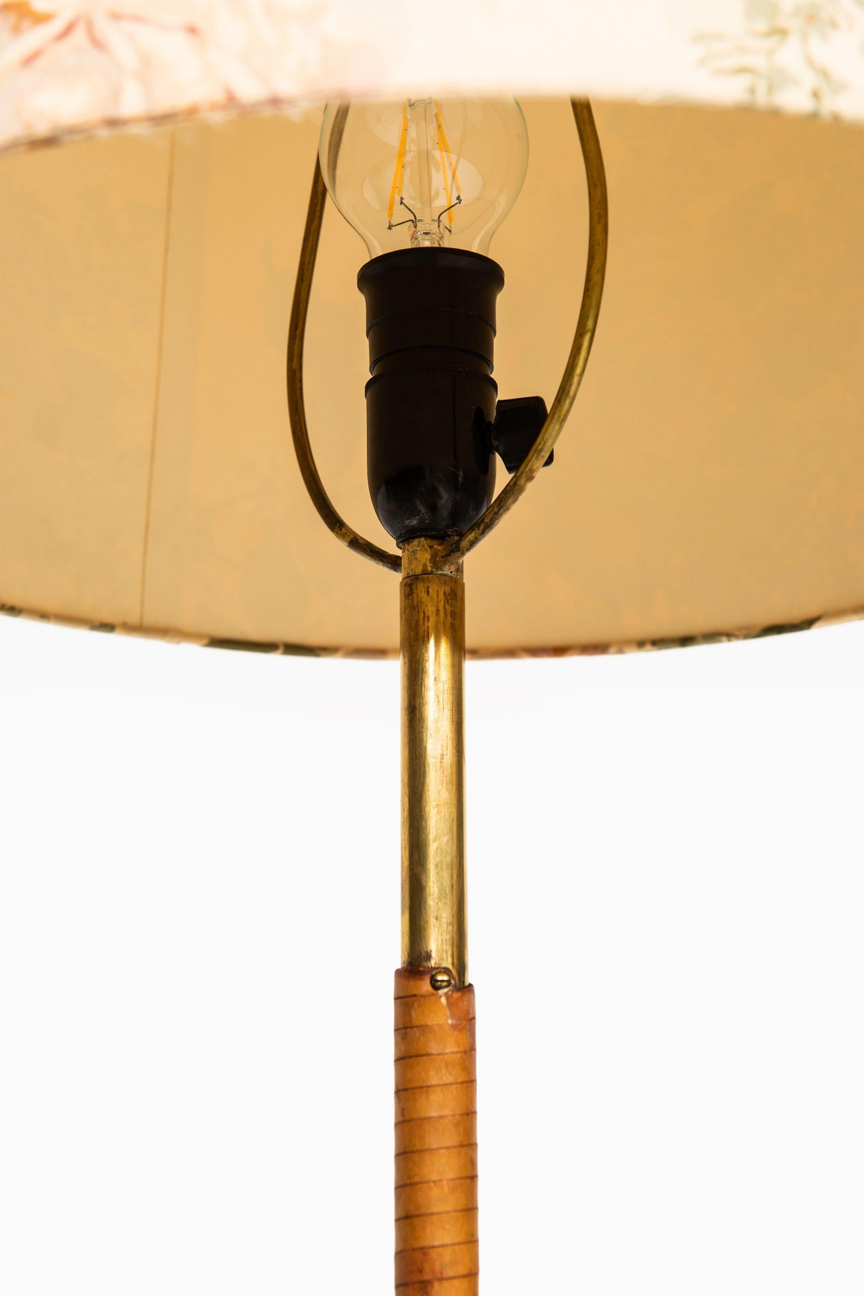 Brass Floor Lamps Attributed to Paavo Tynell Produced in Finland For Sale