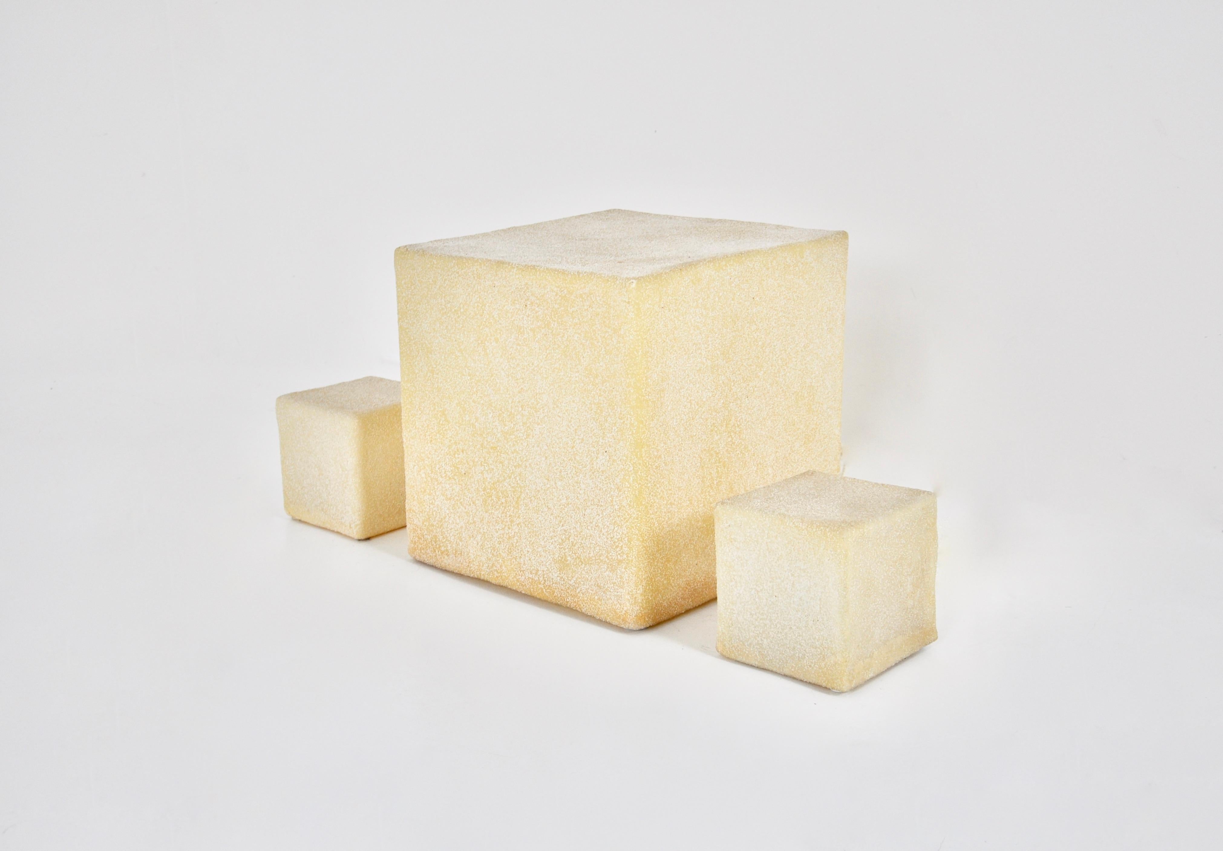 Set of 3 Cube-shaped in fiberglass and marble powder lamps by André Cazenave for Singleton. Stamped under the lamp. 
Dimensions: Large: H: 37 cm W: 37 cm D: 37 cm. 
Small: H: 16 cm W: 16 cm D: 16 cm
Wear due to time and age of lamps