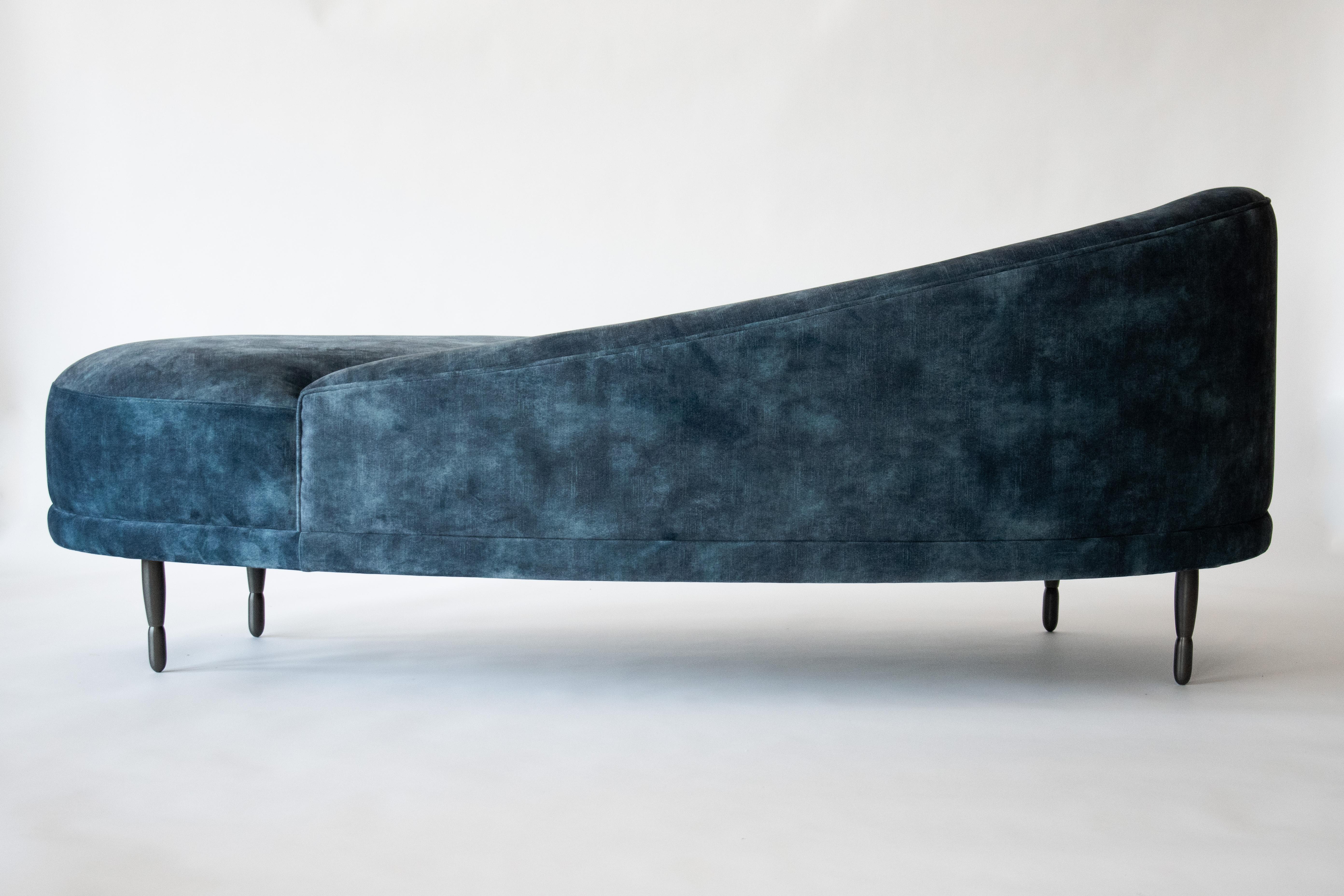 SAMPLE SALE
Fabric - Lovely Atlantic. 

This is a showroom floor model being sold as-is (not made to order). For made-to-order items, please reference the original item listing. 

The Claire Chaise by DeMuro Das has a curved back and seat and