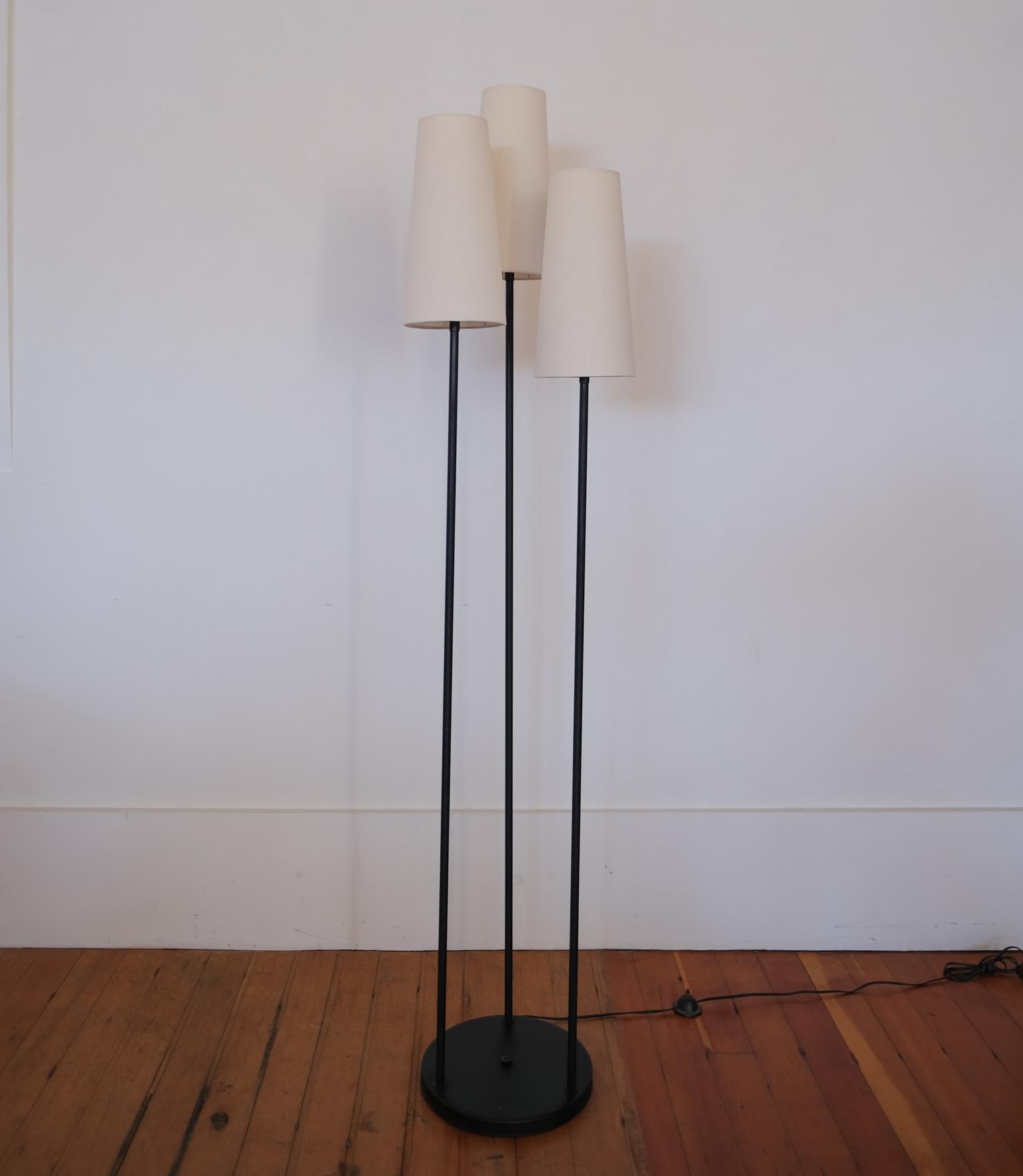 David Wurster three bulb floor lamp. Distributed by Raymor in the early 1950s. New linen shades on original frames. Black enamel finish is original, 1950s.

Wurster was a prolific east coast designer who had numerous items included in MoMA's Good