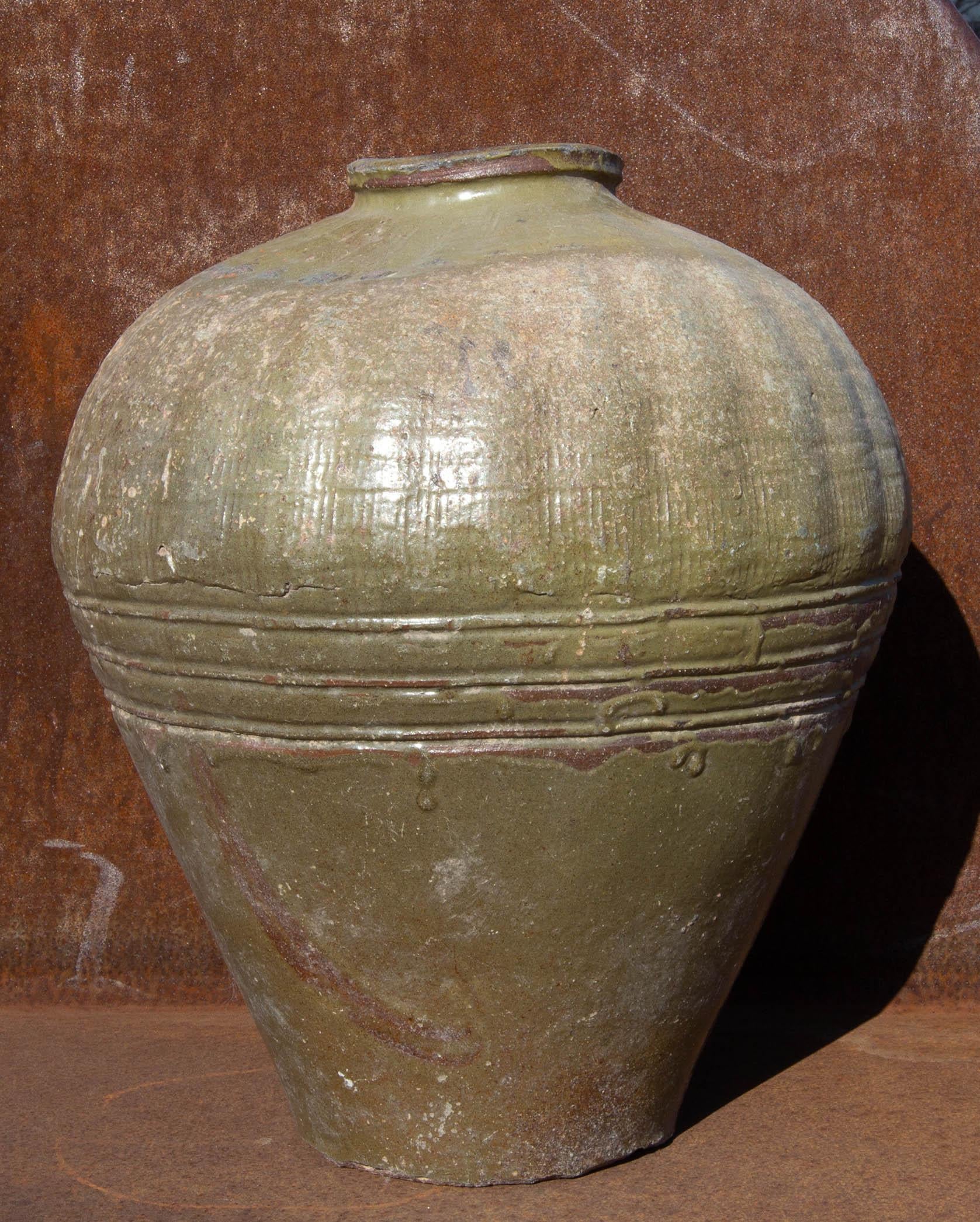 Glazed terracotta rice wine storage jar. China, early 20th century.