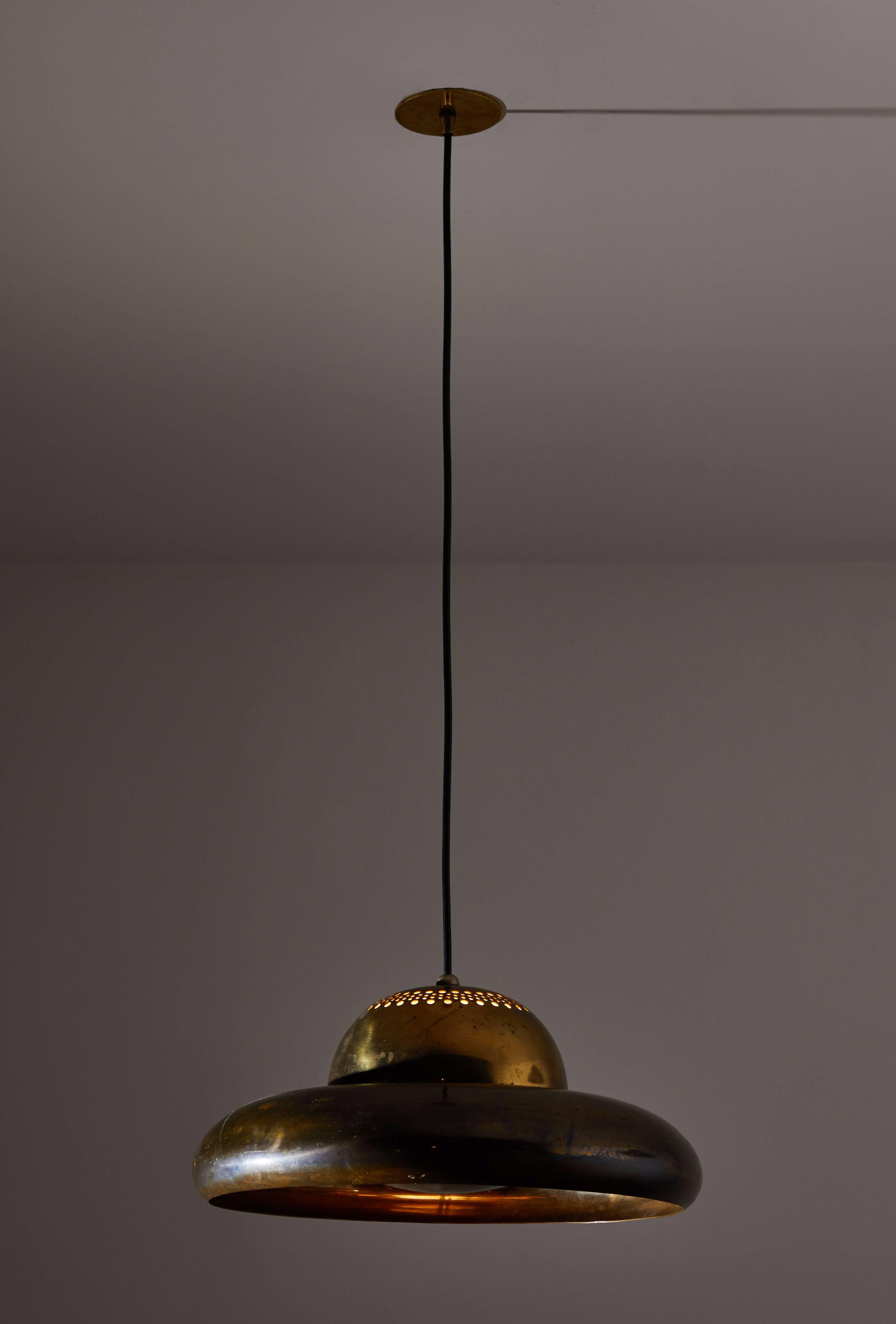 Rare Flor di Loto lotus flower pendant lamp. Designed by Afra & Tobia Scarpa and manufactured by Flos in Italy, 1961. Brass perforated pendant. No longer in production. Wired for US junction boxes. Takes one E27 100w maximum bulb. Overall drop can