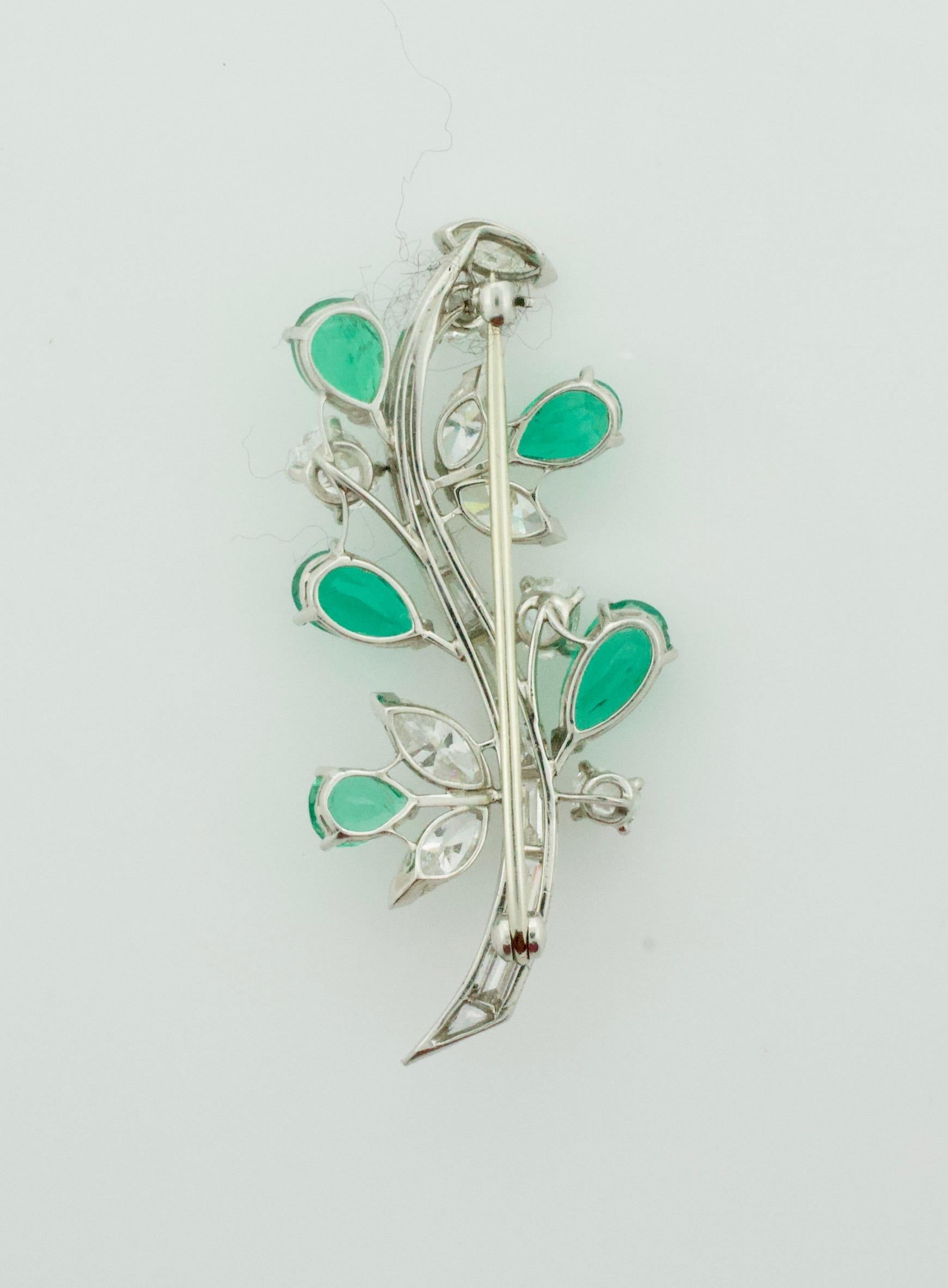 Flora and Fauna Emerald and Diamond Brooch in Platinum Circa 1940's
Total Diamond Weight 2.35 Approximately [GH VVS-VS1]
Five Pear Shape Emeralds  Weighing 2.00 Carats Approximately [bright with no imperfections visible to the naked eye]
Five