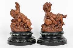 "Flora" and "Grapevine", a French 19th Century Pair of Putti