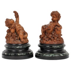 "Flora" and "Grapevine", a French 19th Century Pair of Putti