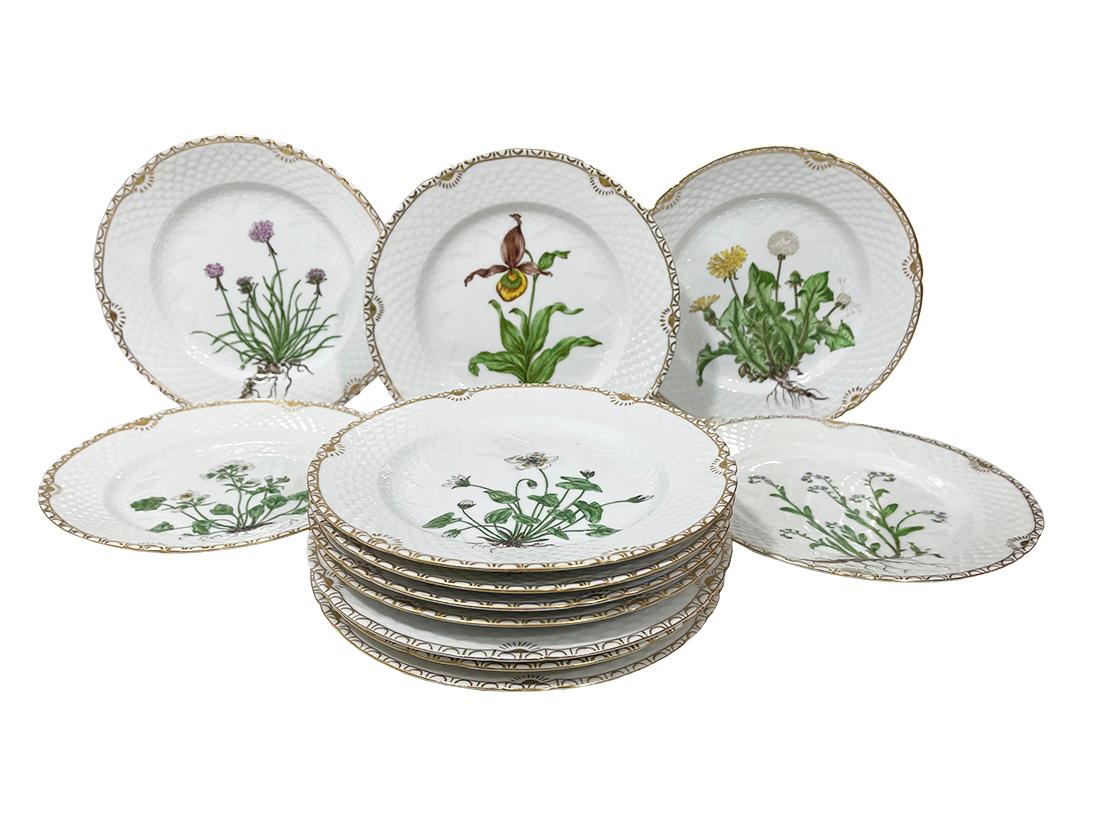 Flora Danica porcelain dinner plates by Bing & Grøndahl, Denmark 1927-1933

Porcelain dinner plates by Bing & Grøndahl hand-painted by Frida Meyer (Gluud) 
Set of twelve porcelain dinner plates, three of which were made in 1933 and five not dated,