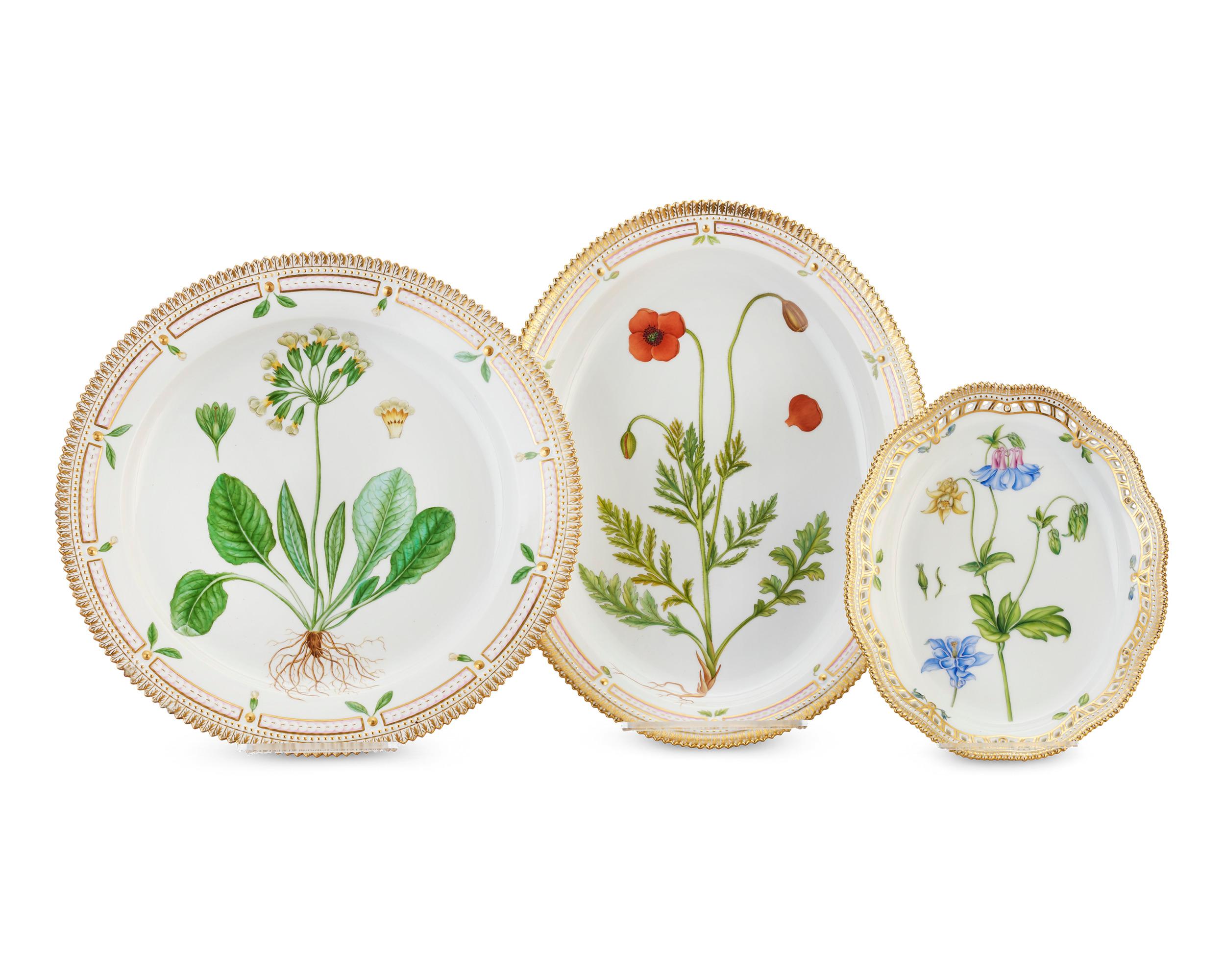 Crafted by the Royal Copenhagen Porcelain Manufactory, this 141-piece dinner service features one of the most prestigious porcelain patterns ever produced — the coveted Flora Danica pattern. The service for 12 boasts rich, hand painted botanical
