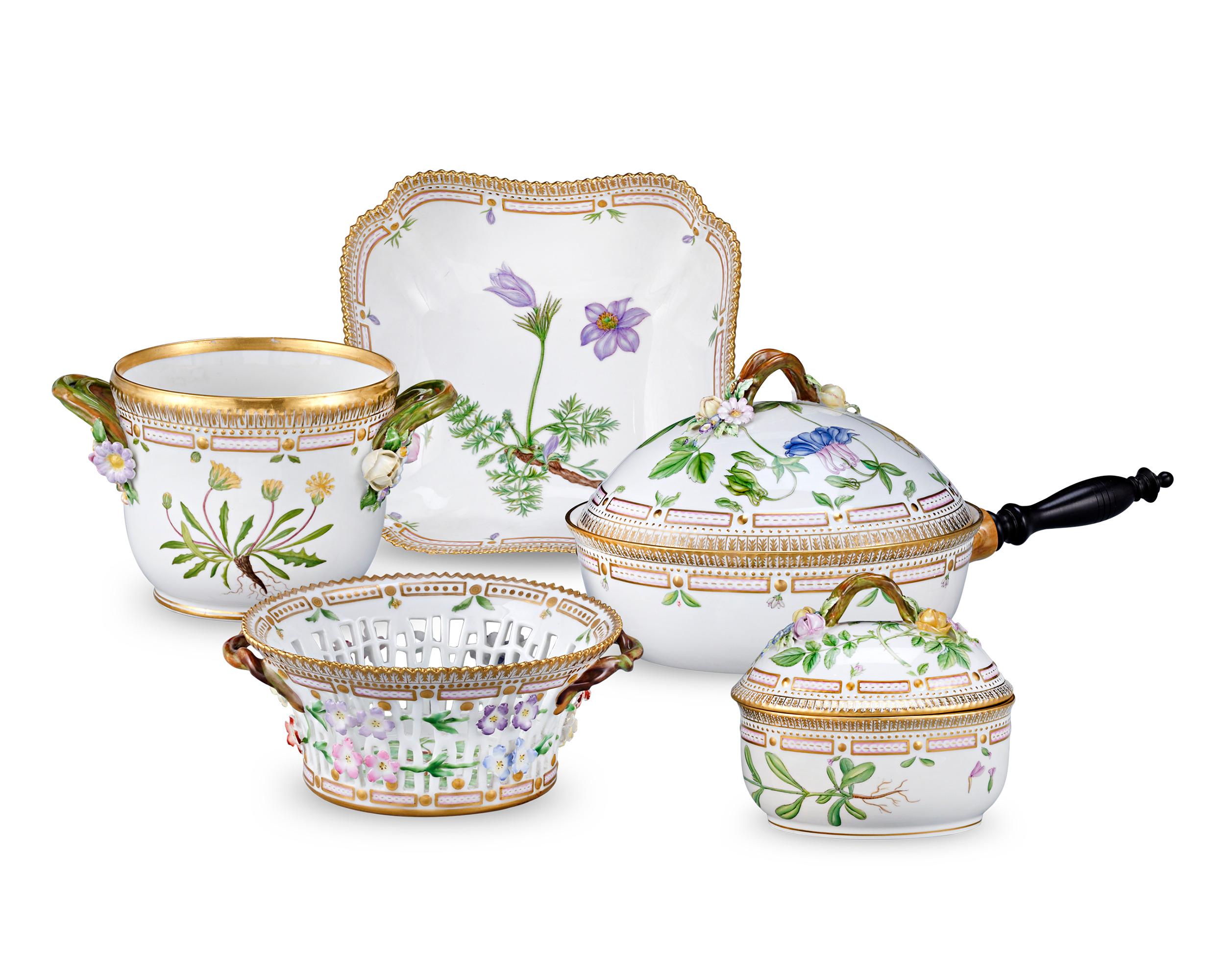 Crafted by the Royal Copenhagen Porcelain Manufactory, this 75-piece dinner service features one of the most prestigious porcelain patterns ever produced — the coveted Flora Danica pattern. The service for 12 boasts rich, hand-painted botanical