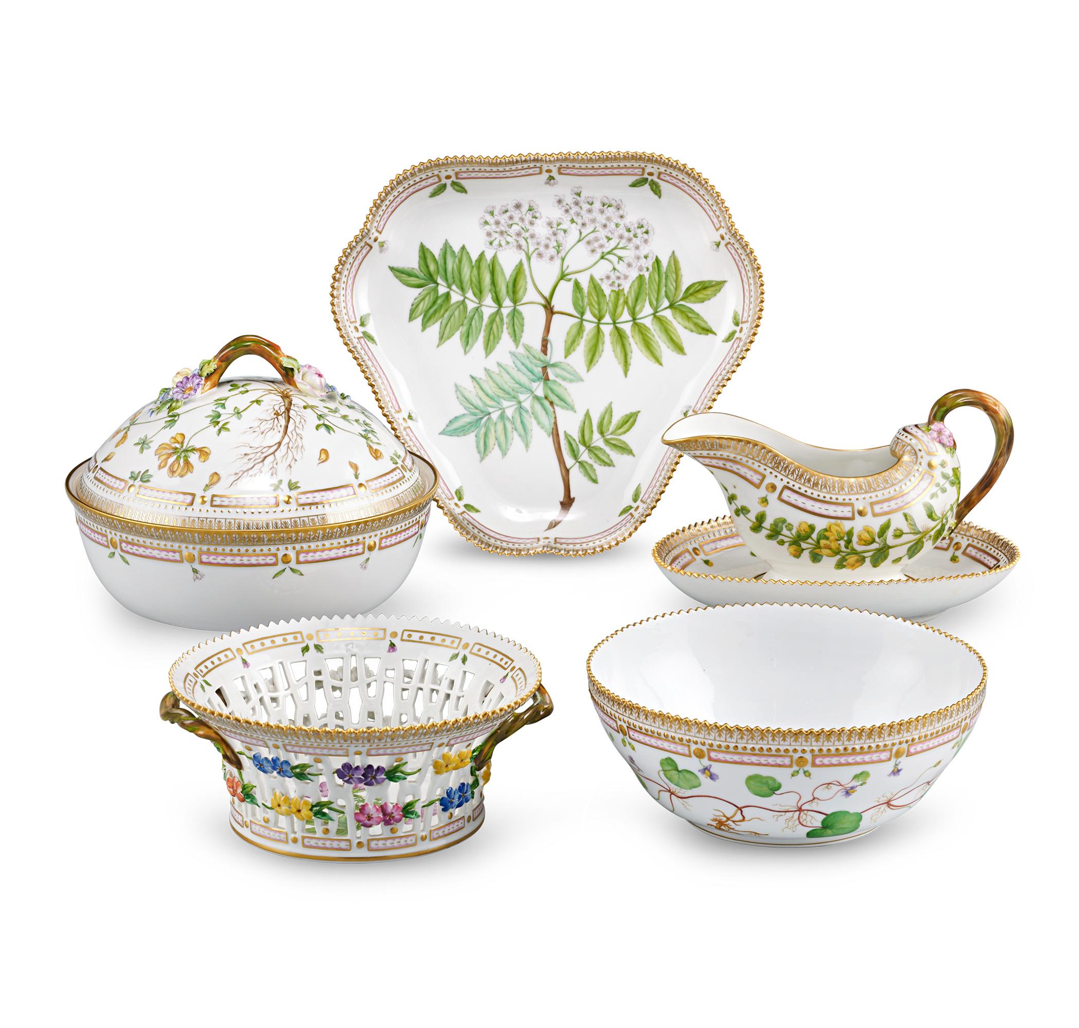 Crafted by the Royal Copenhagen Porcelain Manufactory, this 105-piece dinner service features one of the most prestigious porcelain patterns ever produced — the coveted Flora Danica pattern. The service for 12 features rich, hand-painted botanical