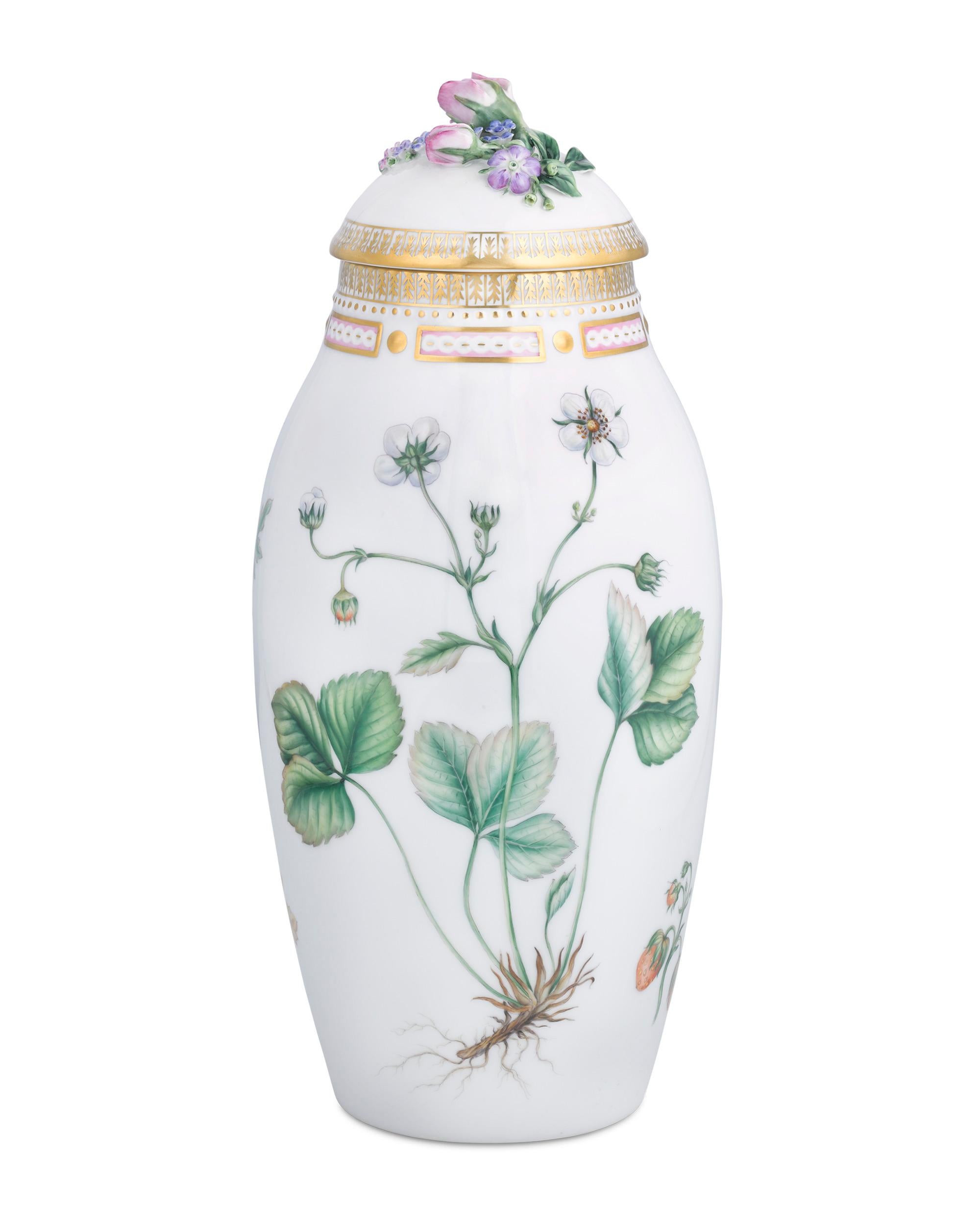 This porcelain covered ginger jar by Royal Copenhagen is crafted in the firm's legendary Flora Danica pattern. Flora Danica ginger jars are extremely rare, and this example exhibits the superior artistry for which this pattern is known, from the