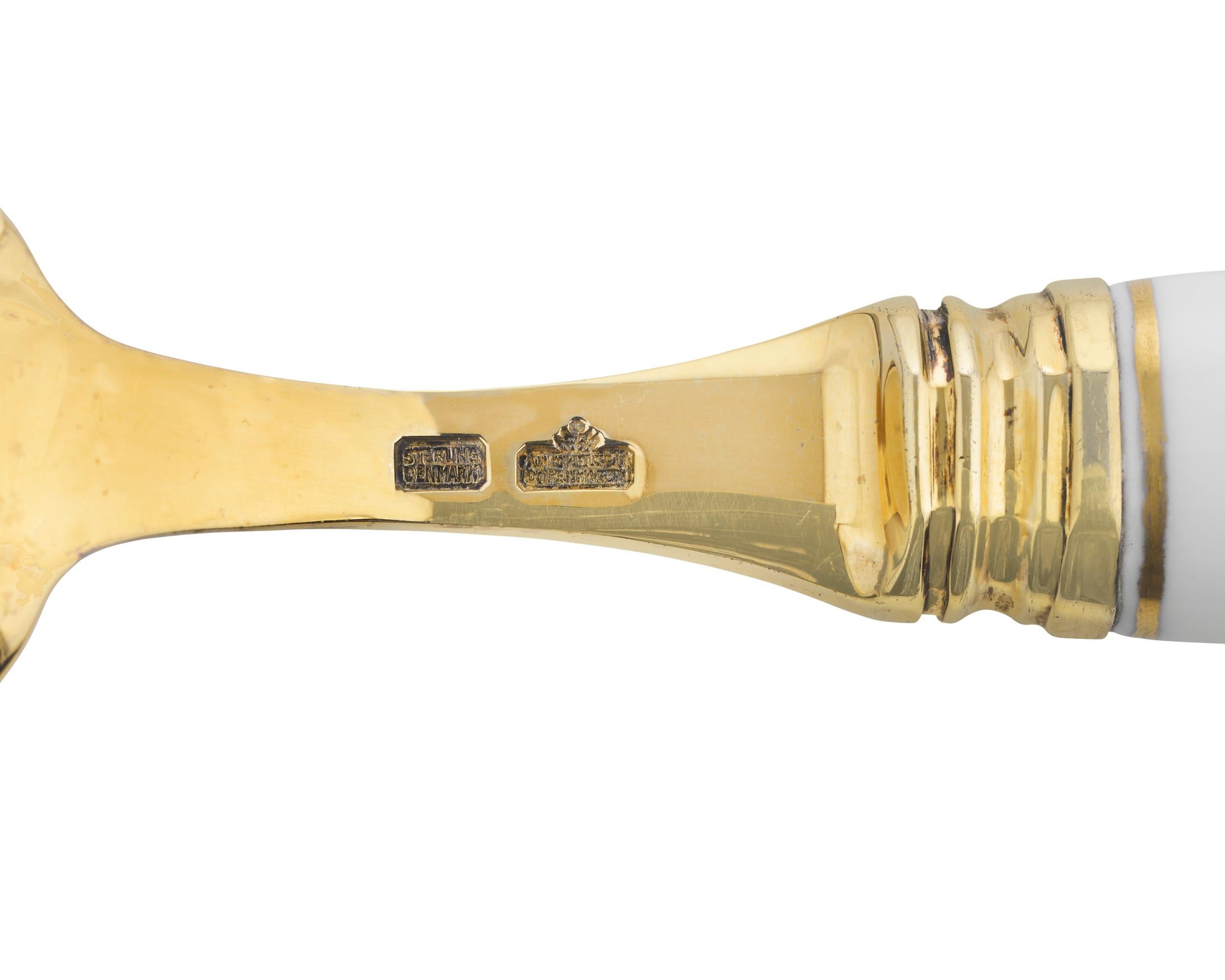 This charming porcelain and silver gilt spoon is part of the celebrated Flora Danica line created by Royal Copenhagen. Once the supplier of the Queen of Denmark, this important firm has been synonymous with royalty and prestige for centuries. Their