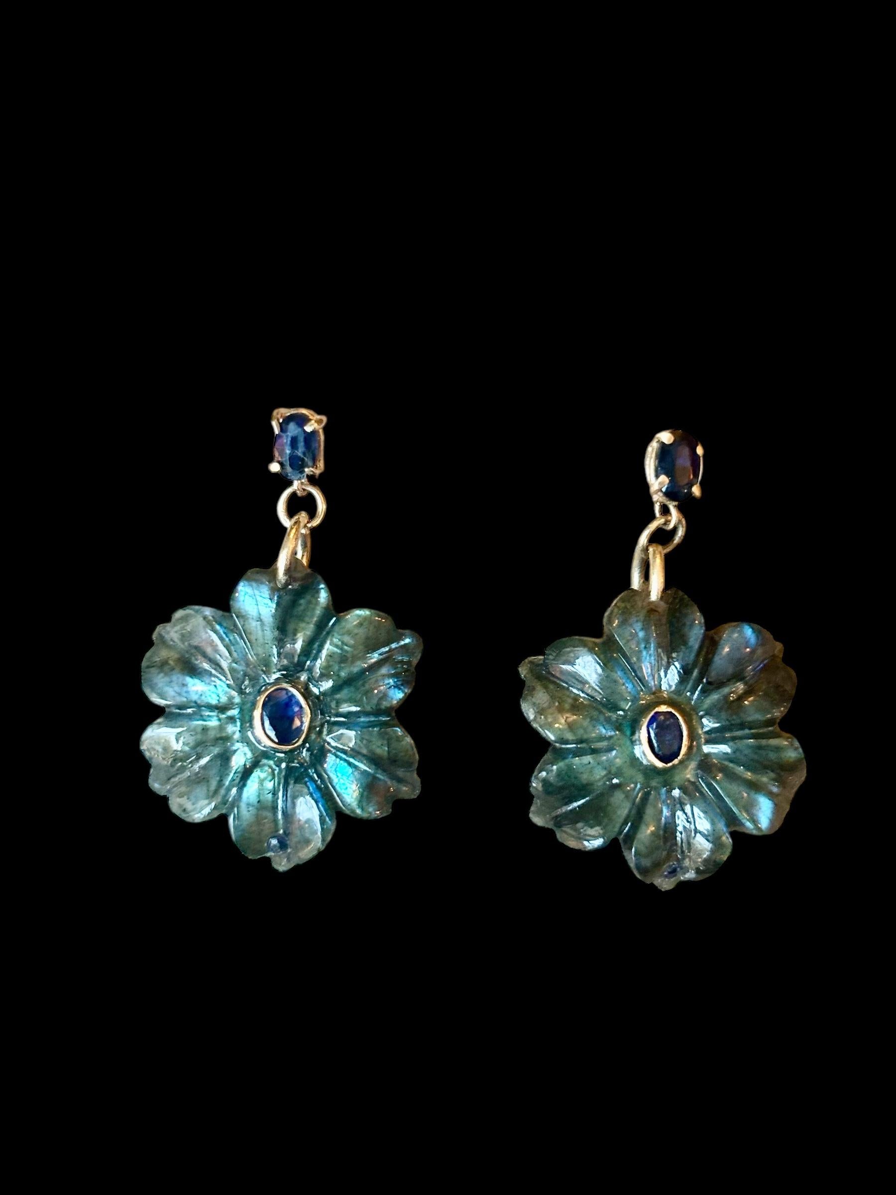 FLORA Earrings

Carved labradorite flowers with center 4x3mm oval blue sapphires bezeled in 14k gold with 5x3mm oval blue sapphires at the 14k gold posts.

The labradorite flowers measure 1