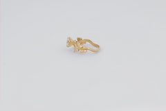 Flora engagement ring with with round moissanite in 14k gold