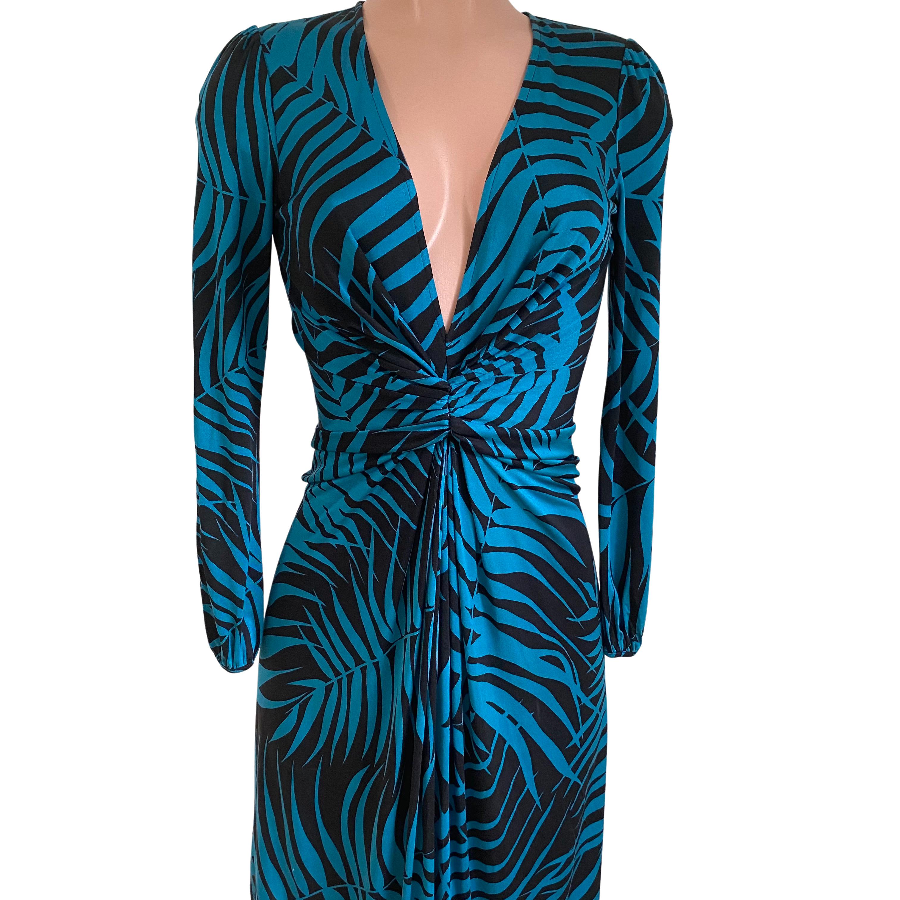 Flattering and classy dress with deep plunge V-neck. 
In original fern print in peacock blue and black.
Invisible back zipper for easy entry, slightly flared skirt with hidden pleat at front.
Approximately 41