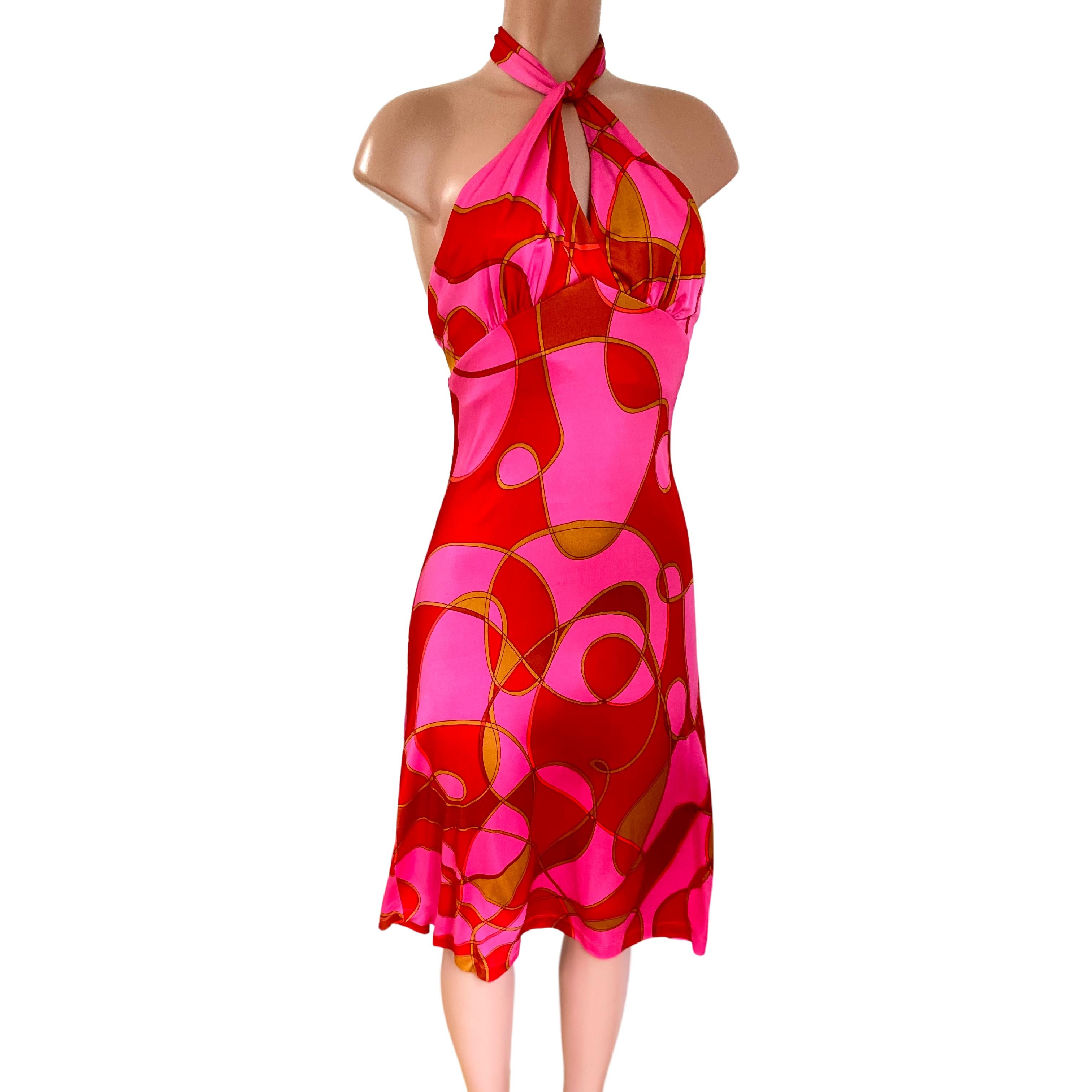 Vibrant geometric pink ruby swirl print.
Easy to wear: elastic back and back neck tie for a perfect easy fit.
Tie can be wrapped different ways.
FLORA KUNG silk dresses are made in premiere quality, long-filament silk yarn which gives a natural