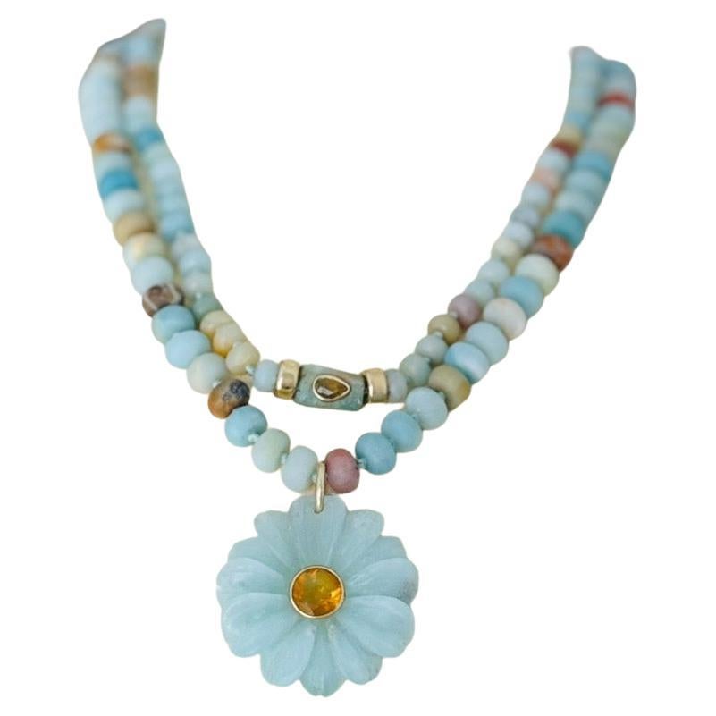 FLORA Necklace
Matte Flower Amazonite, Citrine, 14k Gold

Carved Amazonite flower (1.5” diameter) with a center round 9mm citrine bezeled in 14k gold on a 16.5” matte Flower Amazonite beaded necklace with 14k gold beads and lobster clasp. 

This