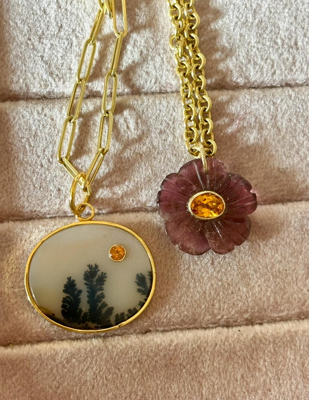 FLORA Pendant

Tourmaline, Mandarin Garnet & 14k Gold

Carved pink/purple tourmaline flower, 20mm diameter, with center stunning 7x5 oval Mandarin Garner bezeled in 14k gold.

This pendant looks gorgeous worn on its own with a gold chain or add to