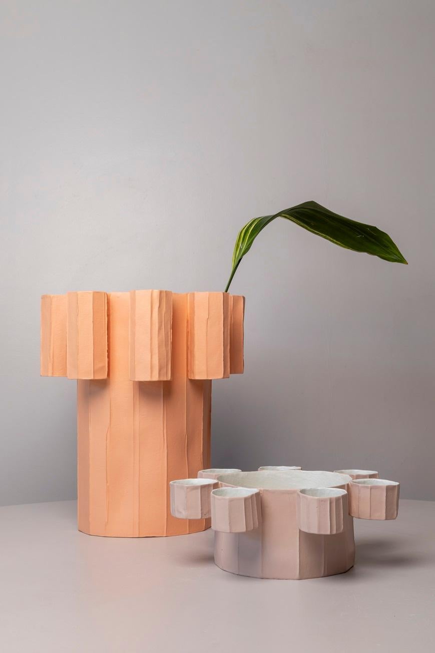 Flora is one of the latest collections by Paola Paronetto, embodying her signature style and artistic vision. With its expansive form surrounded by smaller volumes, Flora evokes an unprecedented flower, a surprising bloom within the domestic