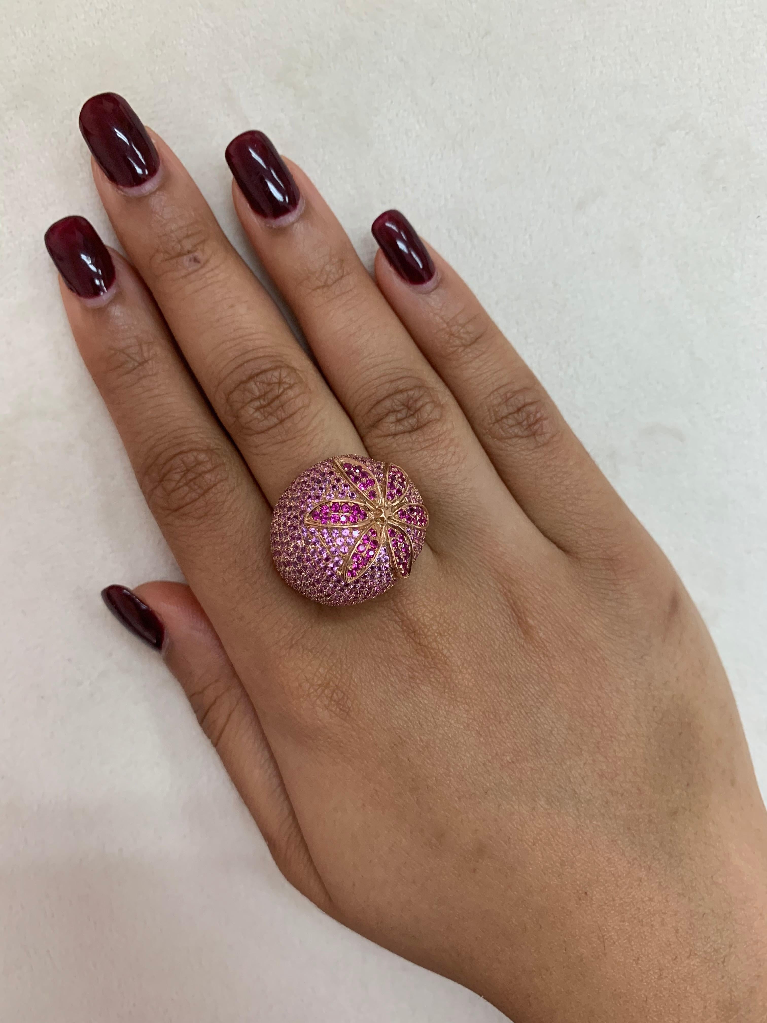 Glamorous Gemstones - Sunita Nahata started off her career as a gemstone trader, and this particular collection reflects her love for multi-colored semi-precious gemstones. This ring presents a floral ruby set on a cluster of pink sapphires. These