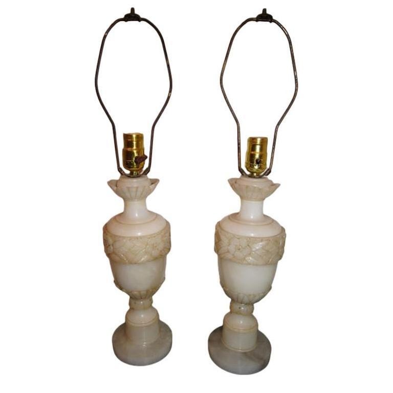 Pair of circa 1930's Italian carved alabaster lamps with floral and foliage motif on body.

Measurements:
Height of body: 13
