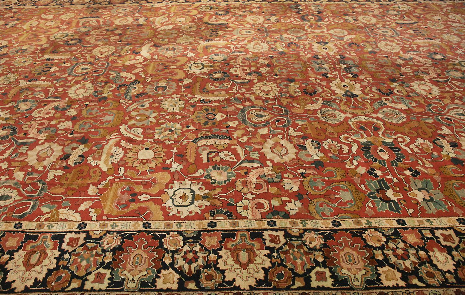 This is a massive antique German Tetex carpet woven circa the 1920s and measures 795 x 395cm in size. The design of this rug takes inspiration from 17th-century Persian vase carpets woven during the Safavid empire. Its border also incorporates a