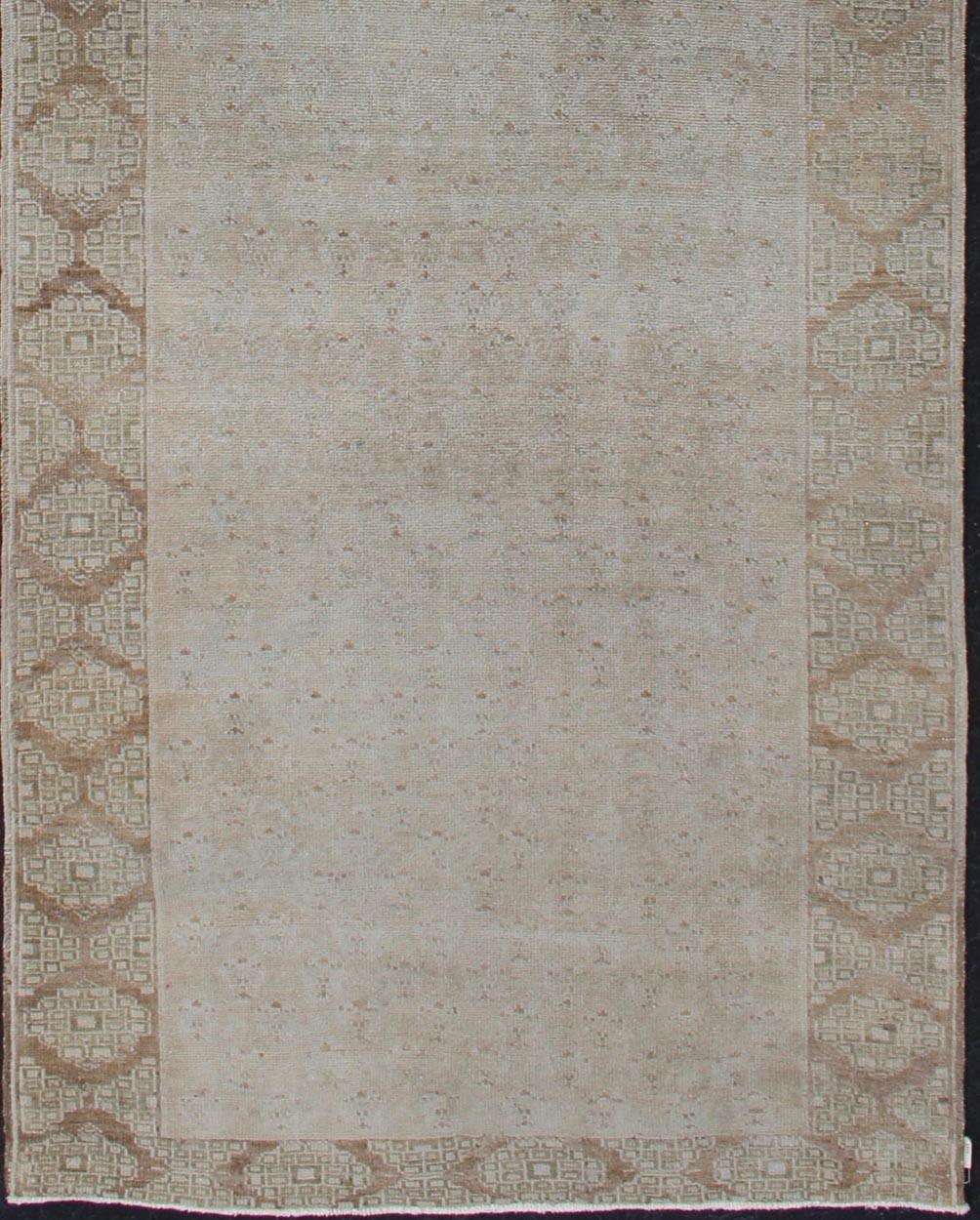 Hand-Knotted Floral All-Over Medallion Vintage Turkish Oushak Runner with Faded Color Palette For Sale