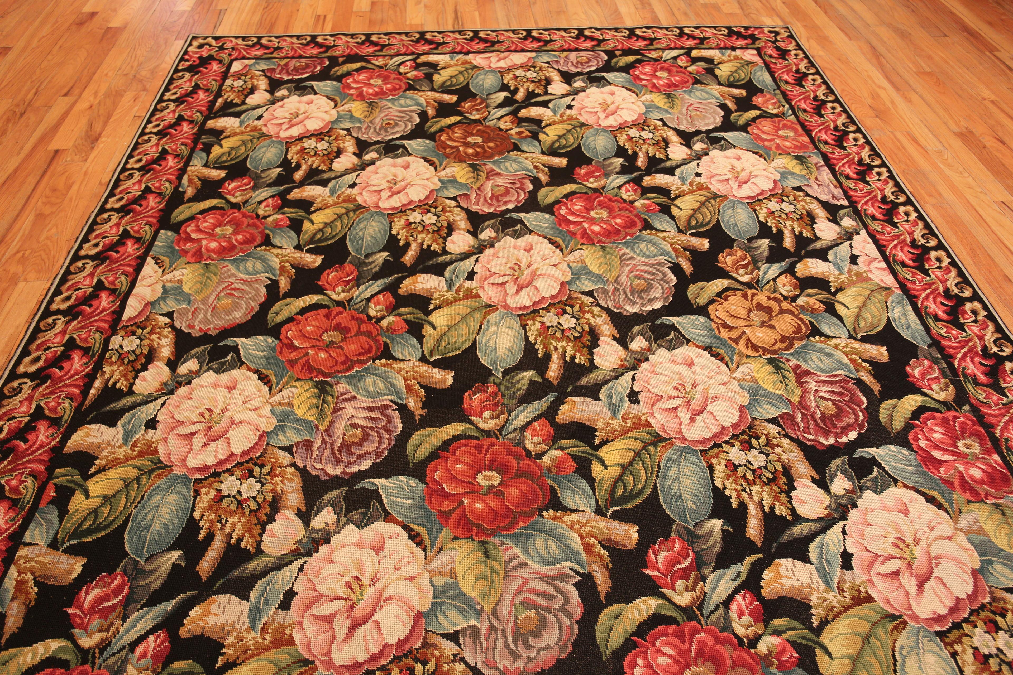Floral Antique English Needlepoint Rug, Country of origin: England, Circa date: 1920. Size: 8 ft 8 in x 10 ft 5 in (2.64 m x 3.17 m)