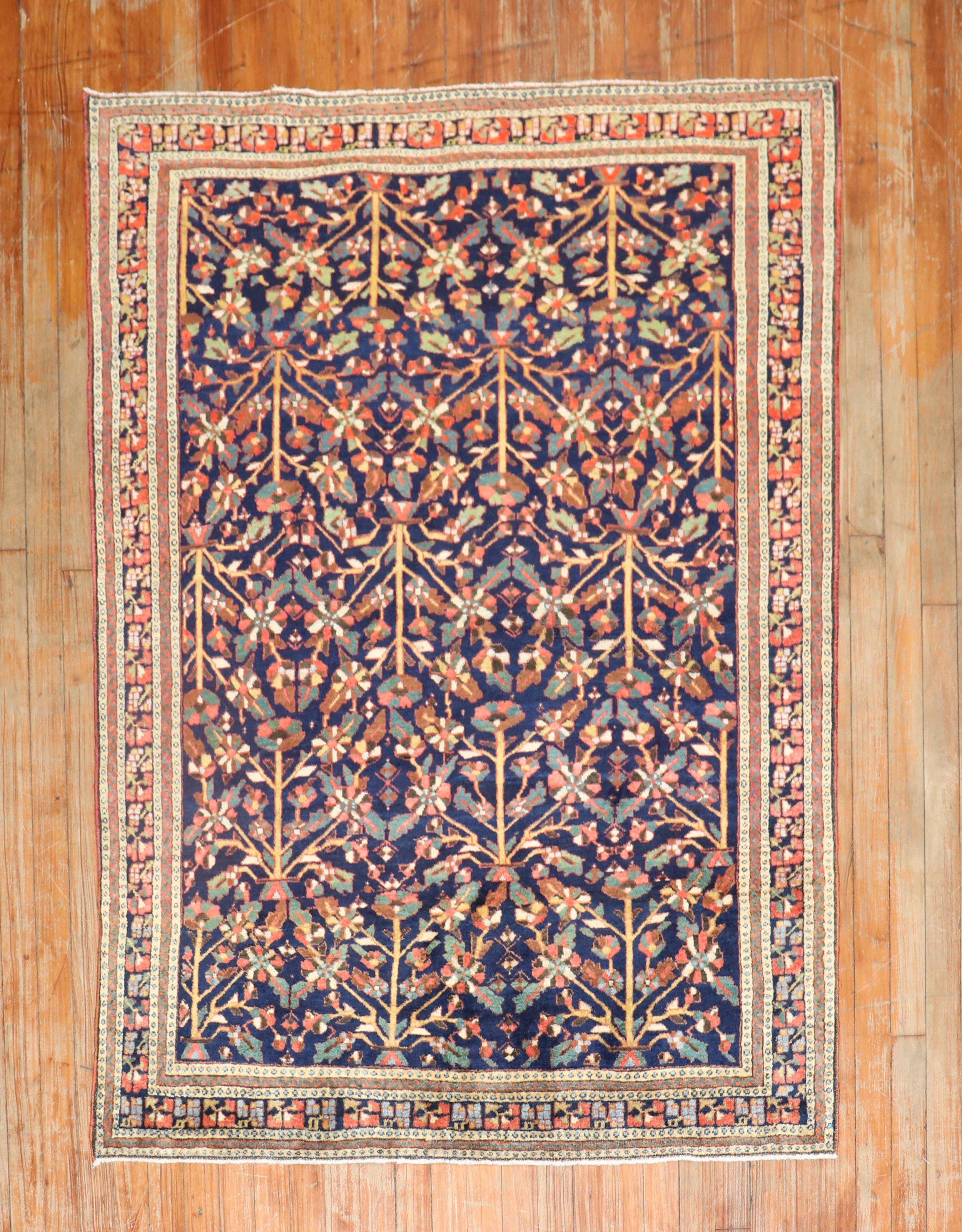 An early 20th Century Persian Farahan rug with an all-over floral design.

Measures: 4' x 5'5''.