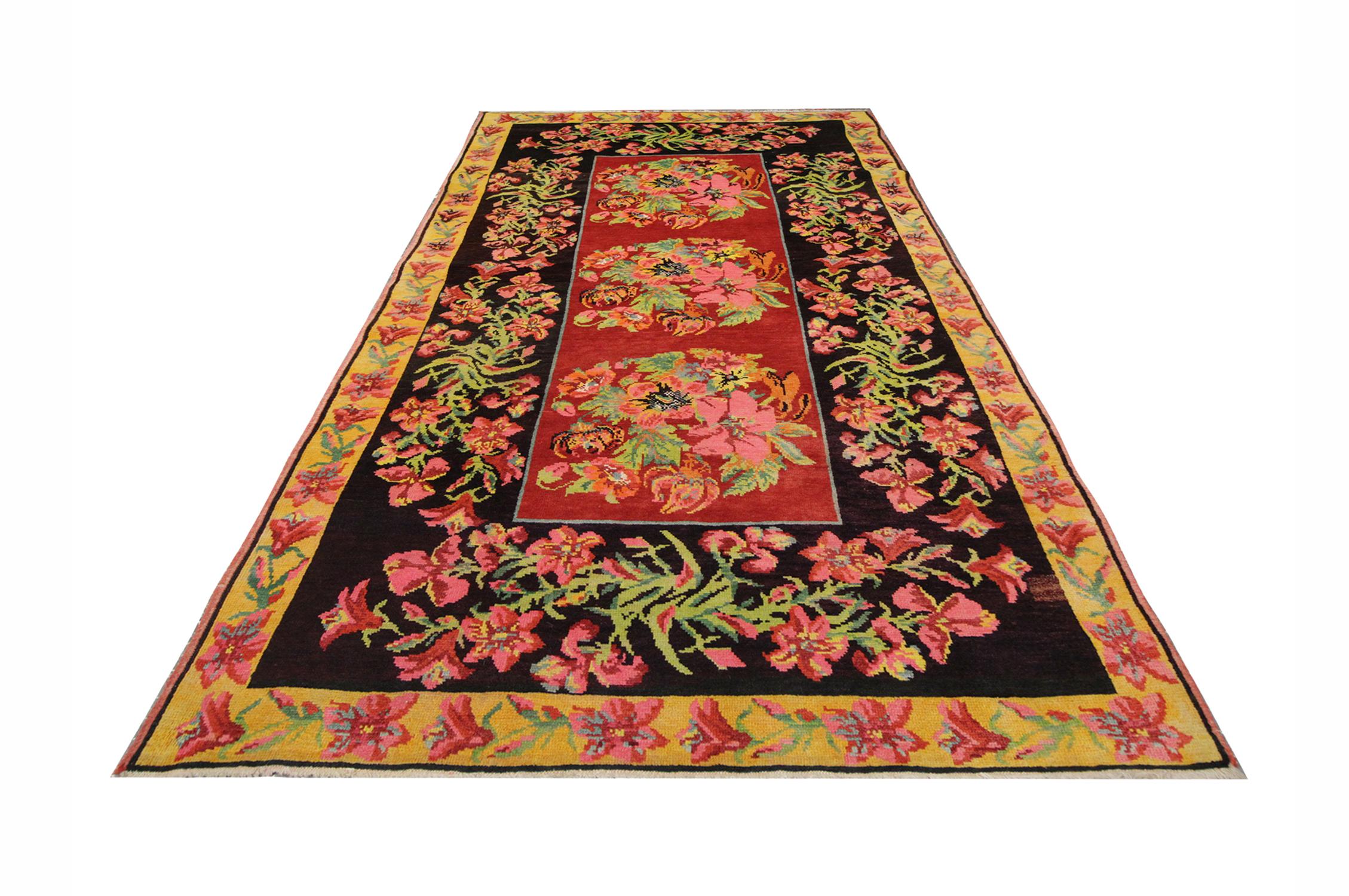 This colorful rug was handwoven and hand-dyed using traditional vegetable dye techniques in Karabagh. Using only the highest quality wool and cotton this flat-weave rug has blue, orange, grey, white, pink and red colors in a pattern across the rug.