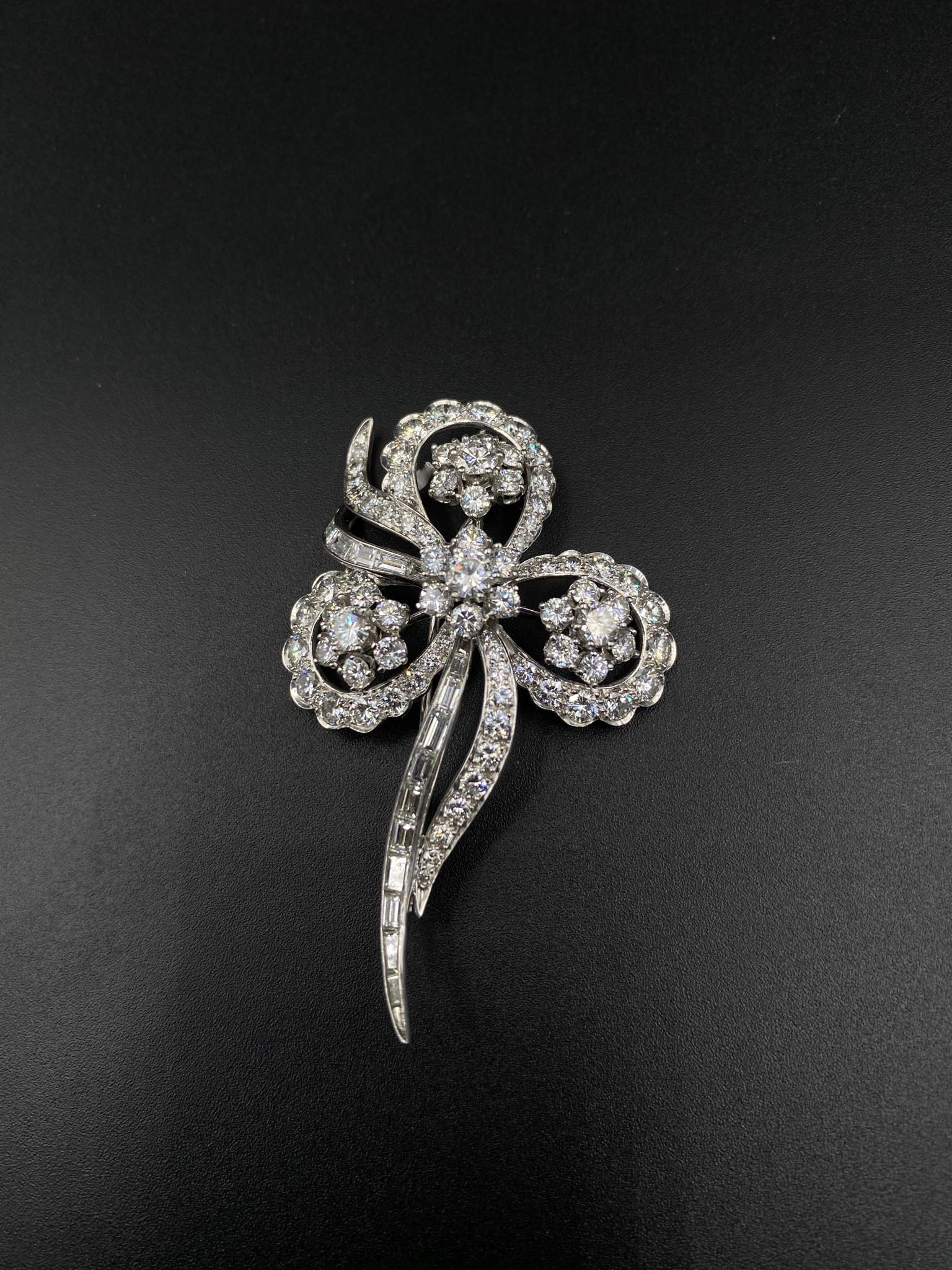 This exquisite Floral Art Deco Diamond Pin is a testament to timeless elegance. Crafted with precision in platinum, it features an enchanting Old European Cut Diamond at its center, radiating with vintage charm. The intricate floral design adds a