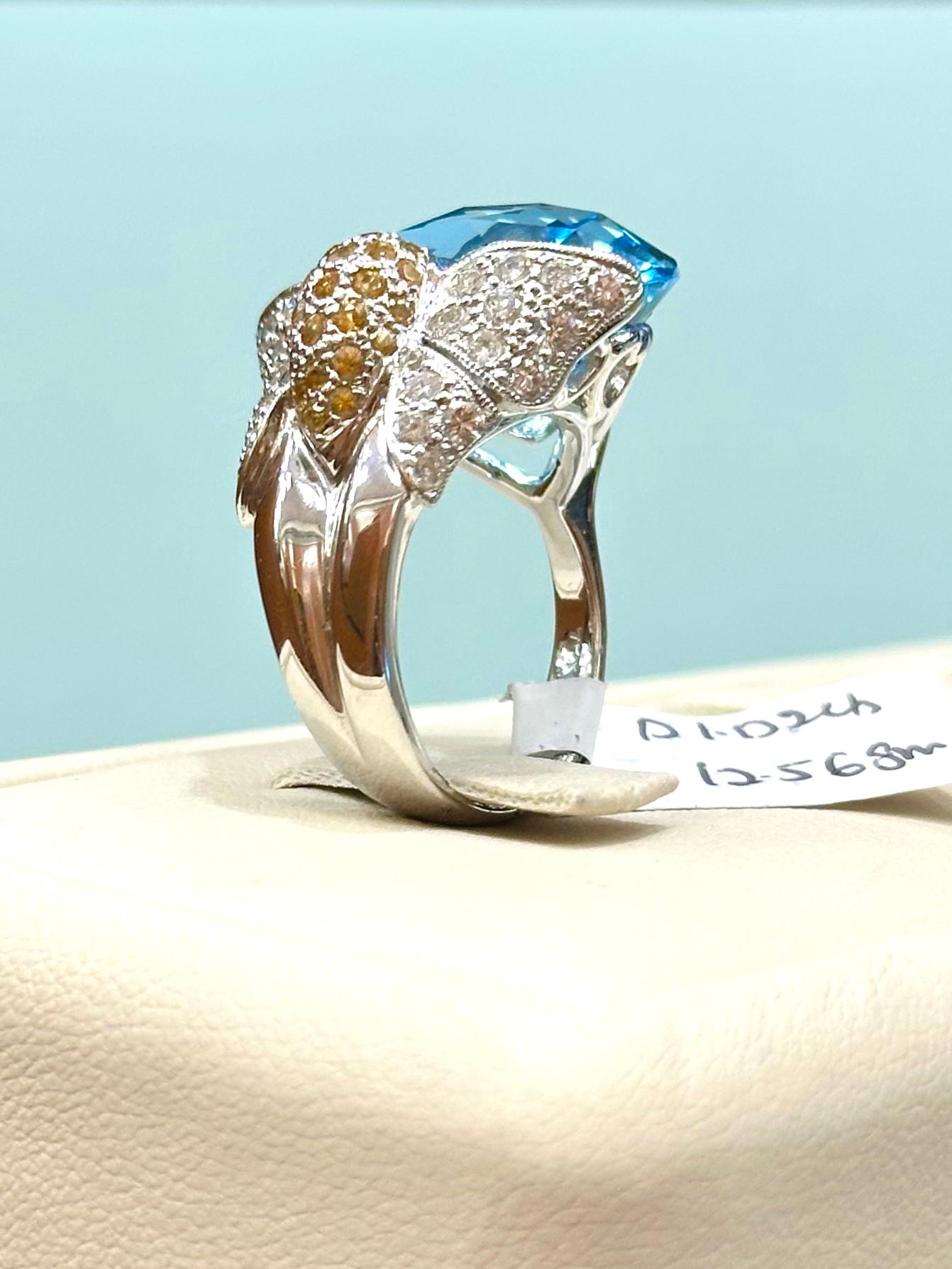 Mixed Cut Floral Blue Topaz Ring with Diamonds and Yellow Sapphires set in 18k White Gold For Sale