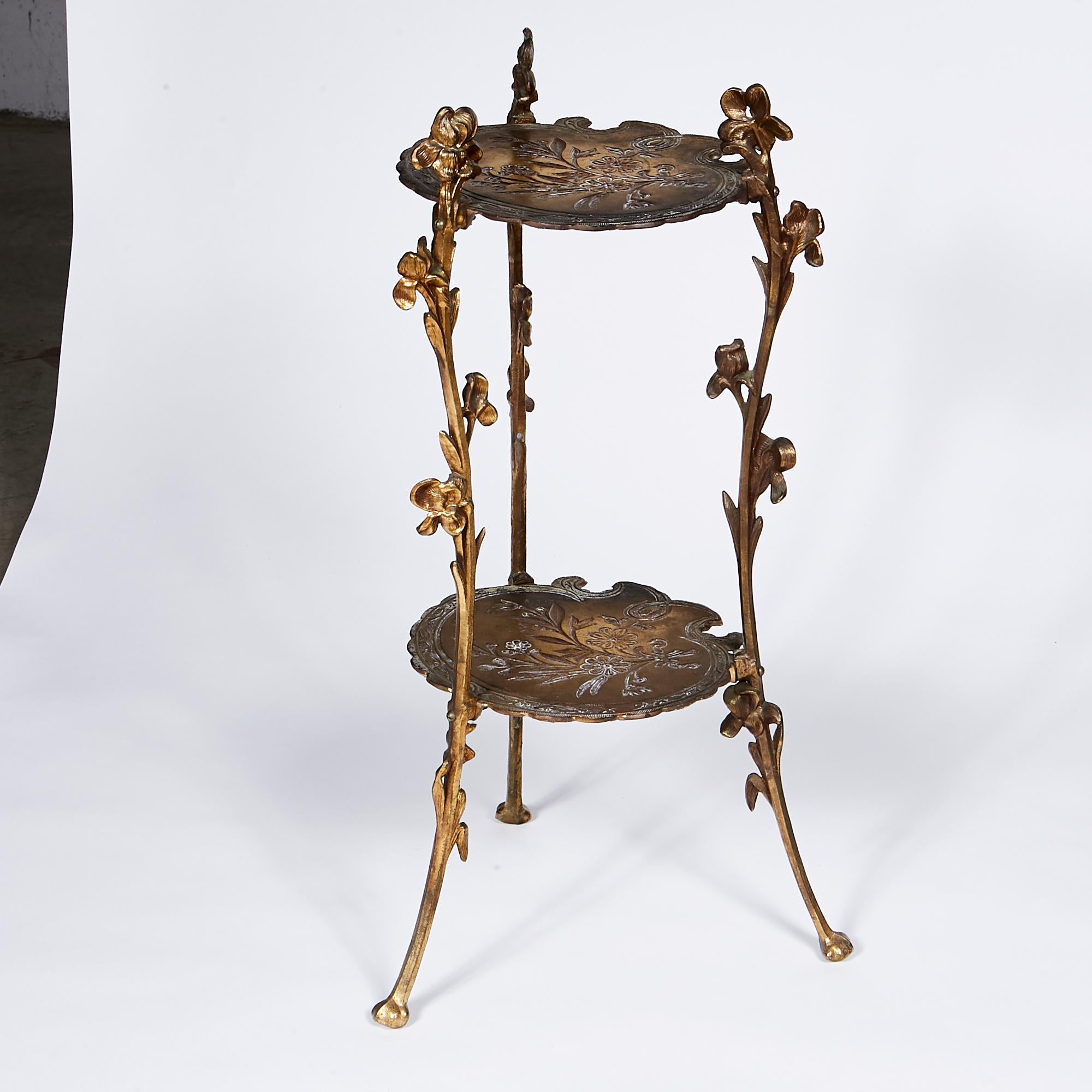 Vintage floral accented solid brass two-tier plant stand or side table. No marks. In very good used condition.