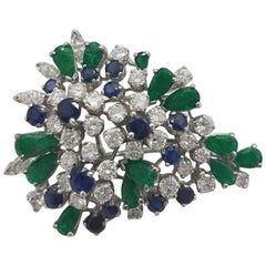 Floral Broach in 18 Karat White Gold with Diamonds Emeralds and Sapphires