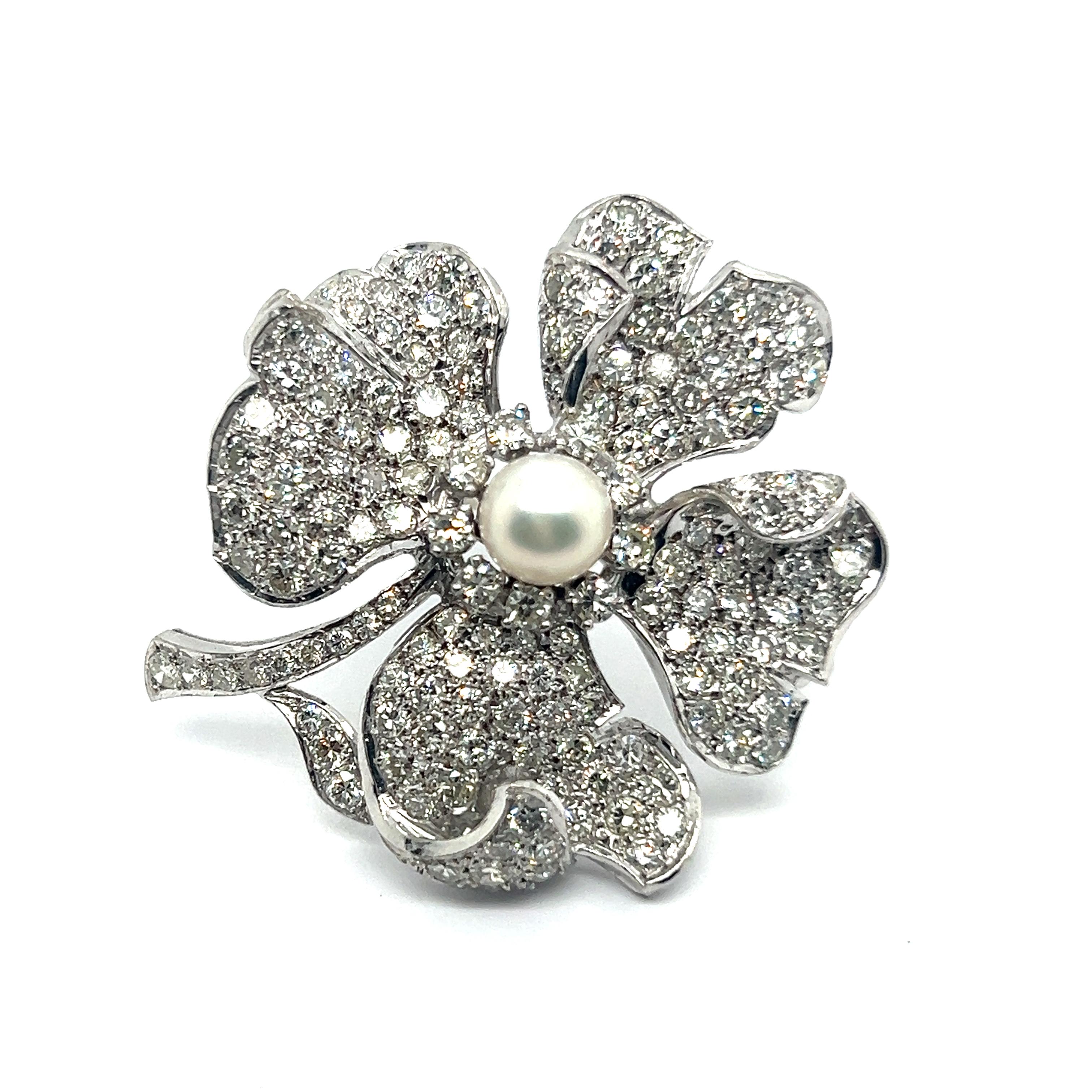 Evoking the ethereal beauty of a freshly picked spring blossom, this exquisite flower brooch embodies timeless elegance. 

Skillfully fashioned in platinum, it blooms with an array of 154 dazzling diamonds, G-H color and vvs clarity, totaling 4.60