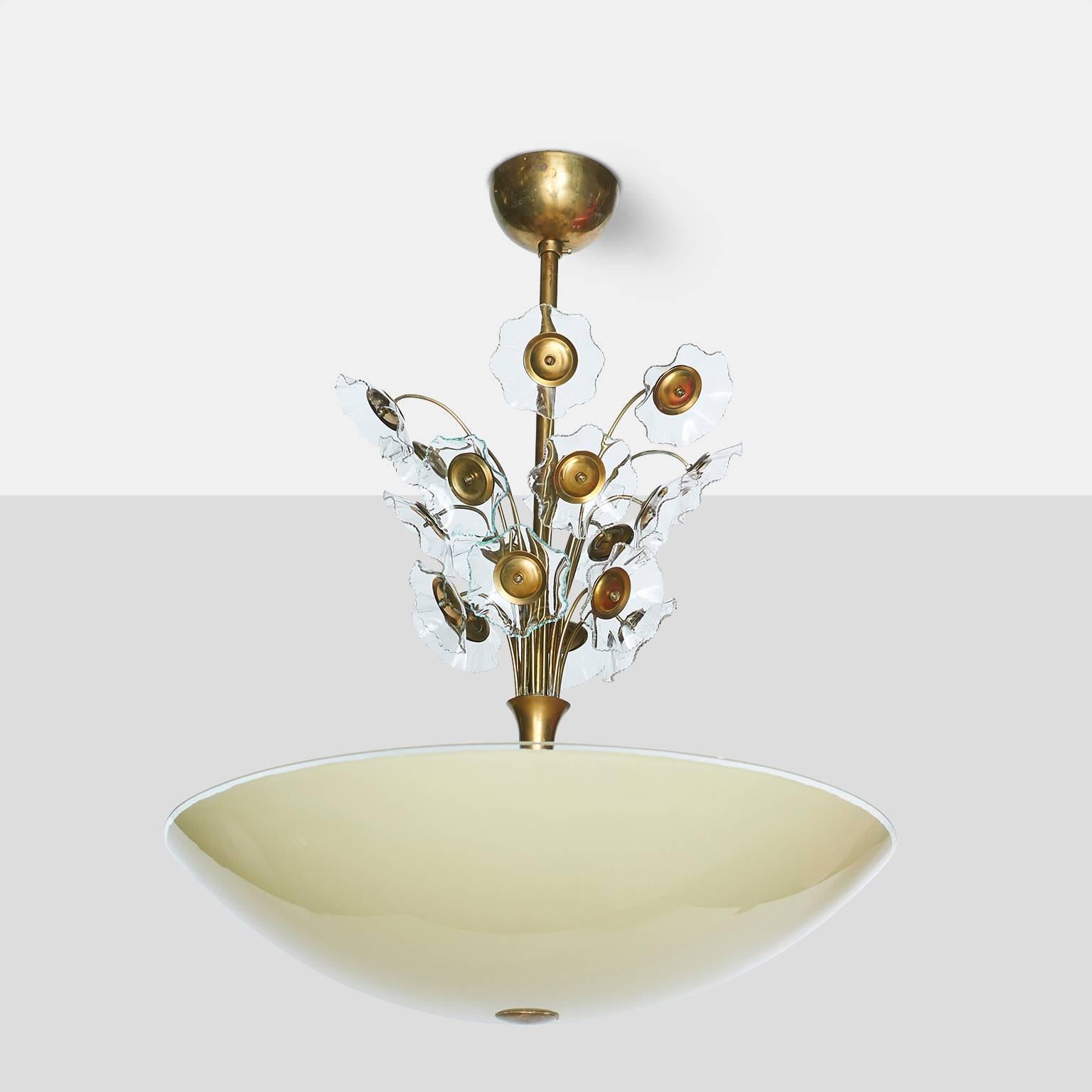 Floral chandelier by Lisa Johansson-Pape
Large chandelier with a yellow glass shade and transparent glass flowers above the stem on an all brass frame,
Finland, circa 1960s.