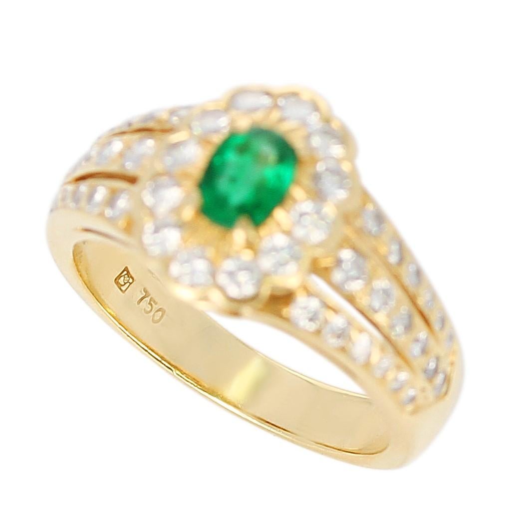 Oval Cut Floral Cluster Emerald and Diamond Ring, 18 Karat Yellow Gold For Sale