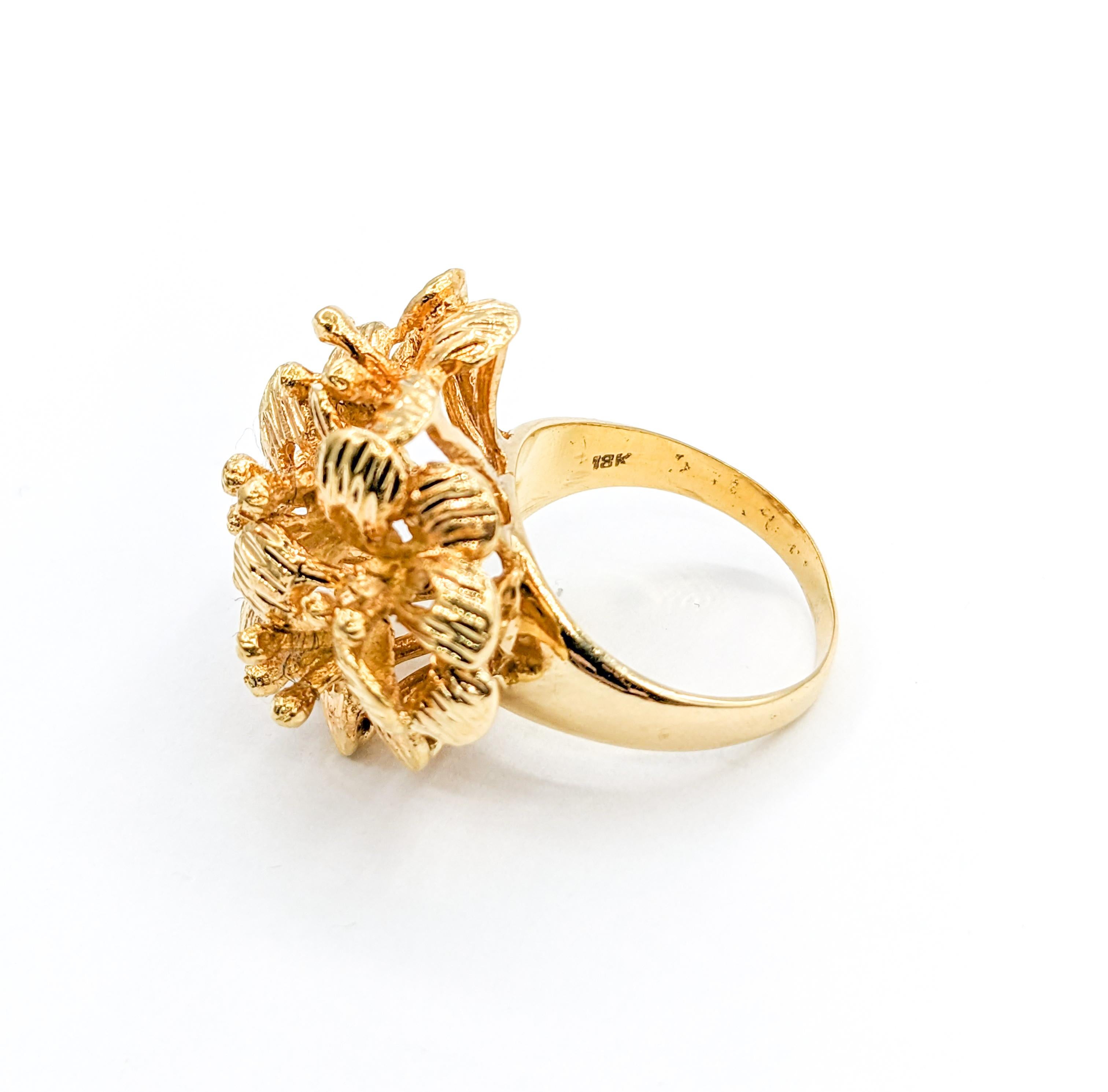 Lovely Vintage Floral Cluster Ring in Gold

Embrace the allure of yesteryears with this beautifully crafted vintage floral cluster ring in 18K yellow gold. Its design, reminiscent of a bouquet of hibiscus flowers, evokes an era of timeless elegance.